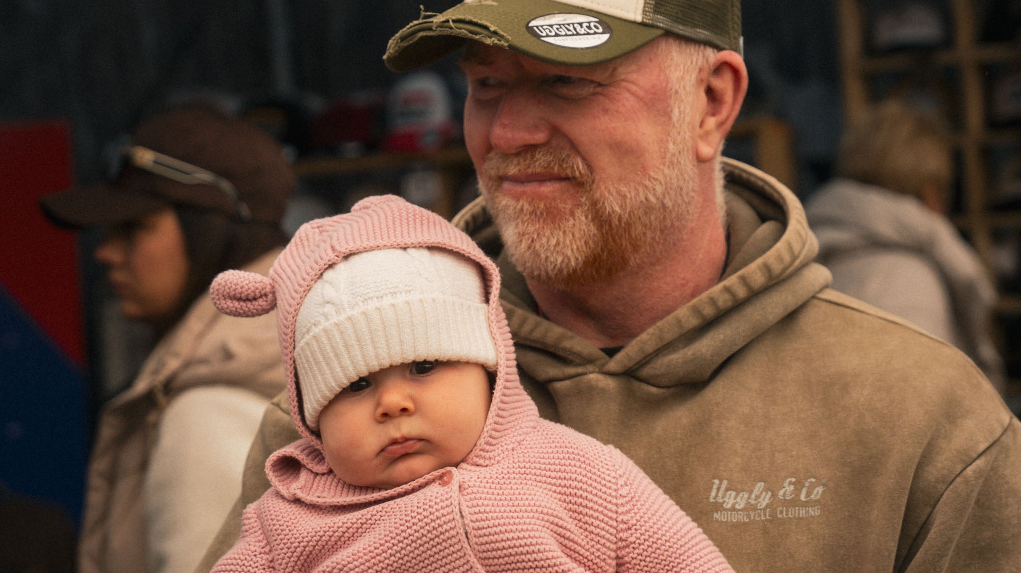 motorsport fan with baby at race event