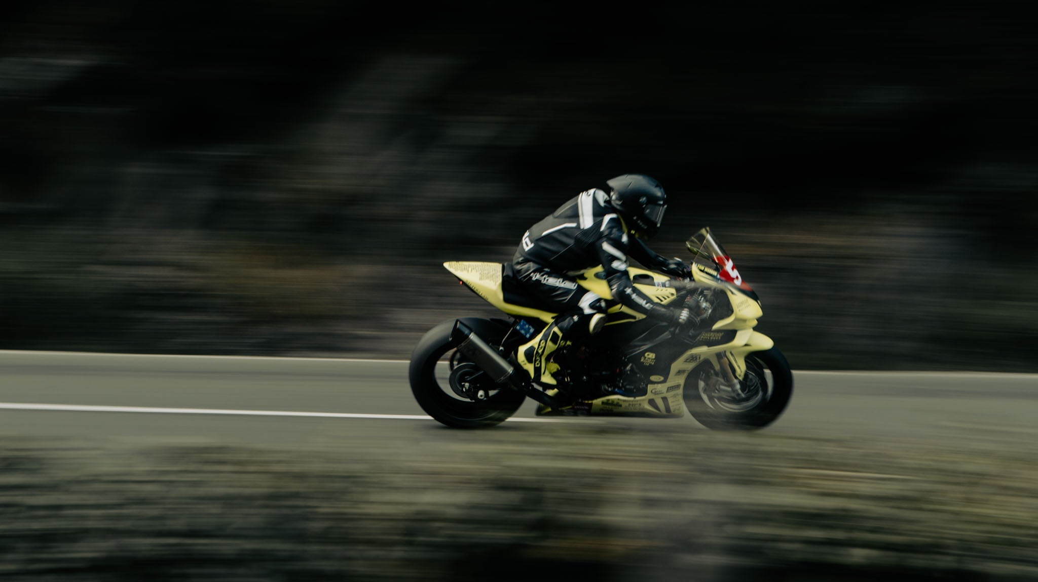 panning shot of motorbike rider at the Isle of Man tt