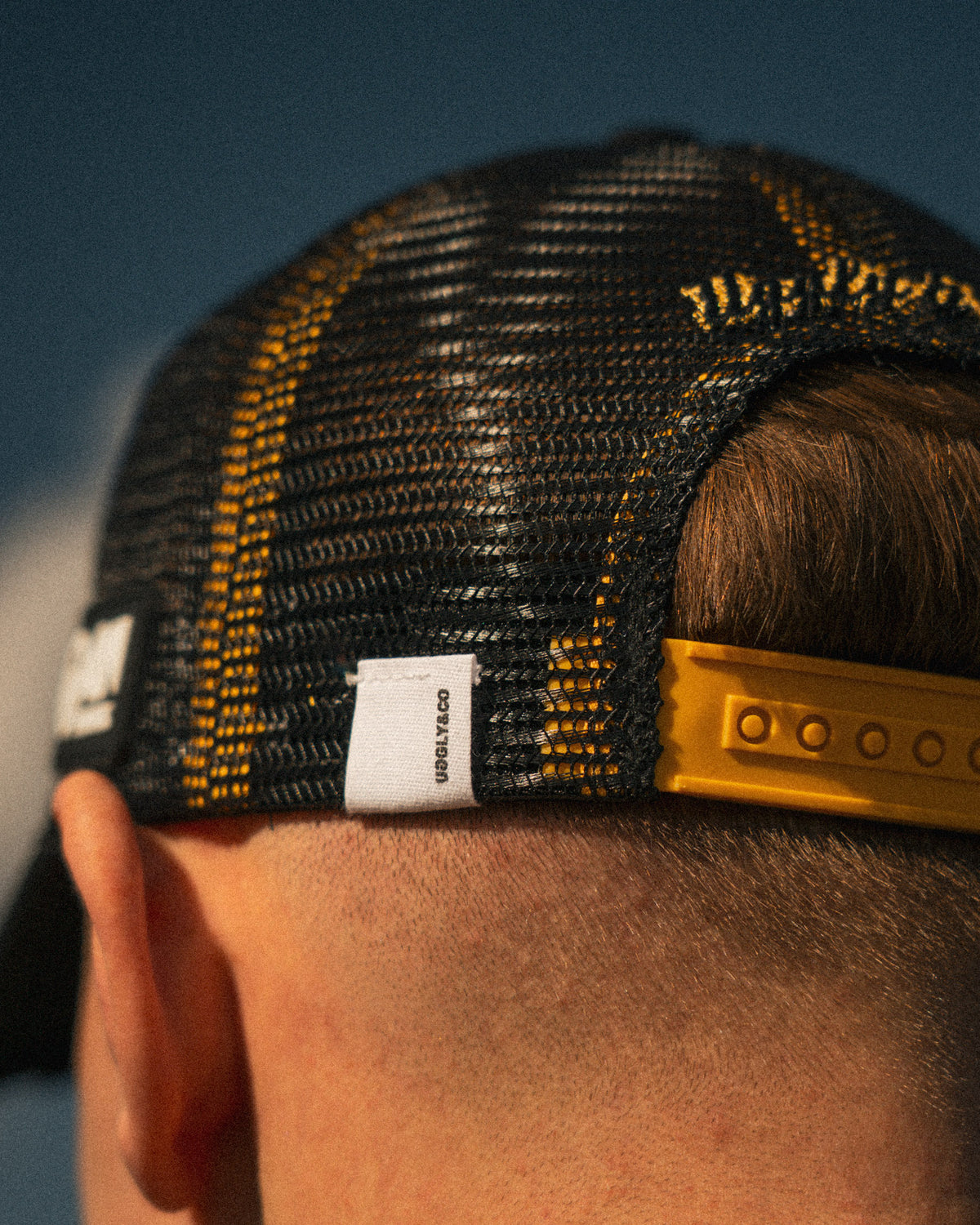 close up detail shot of logos on baths racing cap
