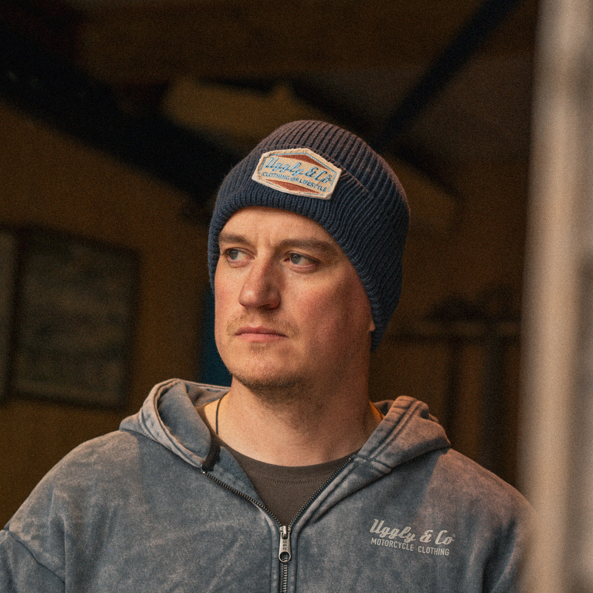 Man wearing a blue beanie in lifestyle photo
