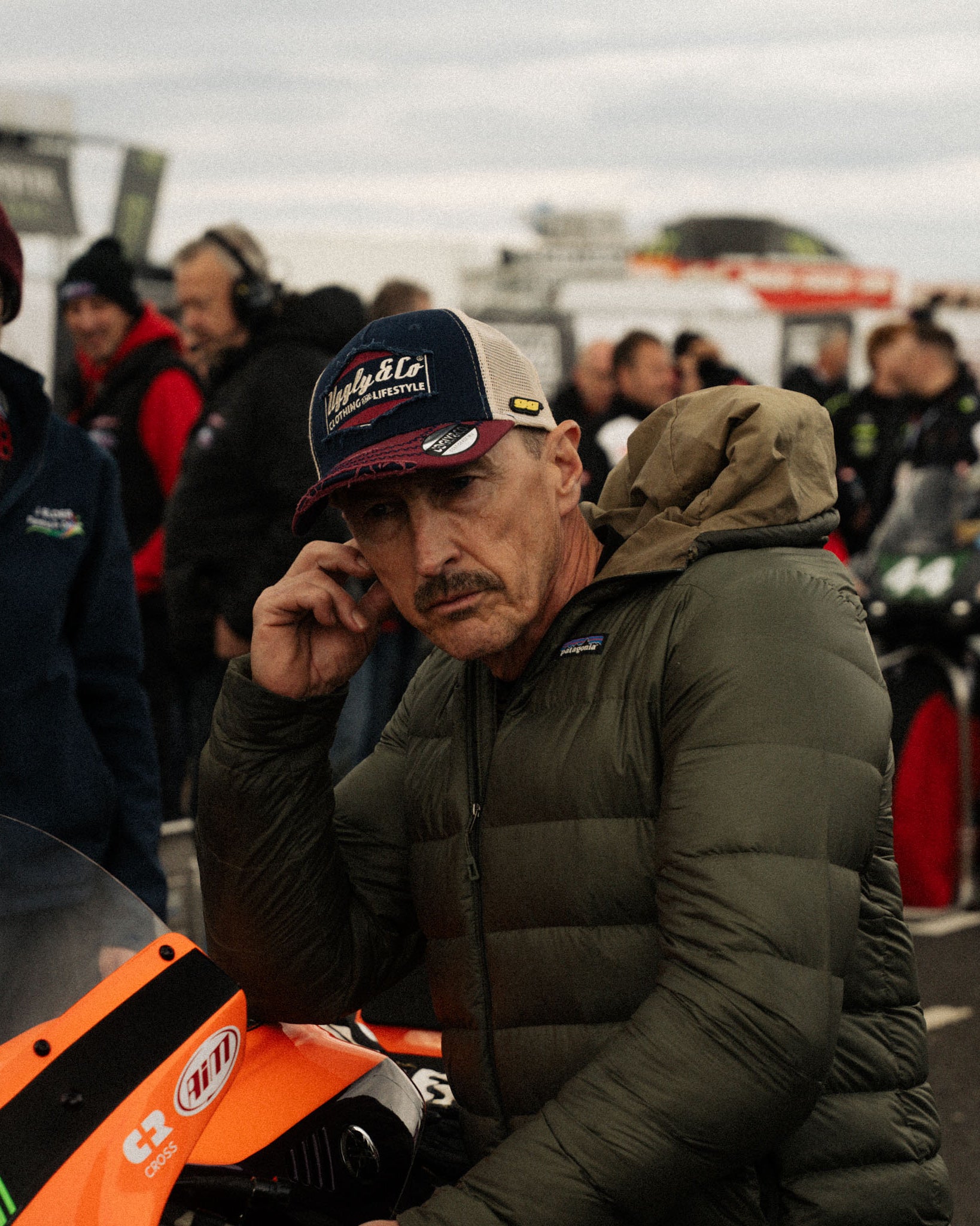 Jeremy McWilliams checking bike on grid of a race track