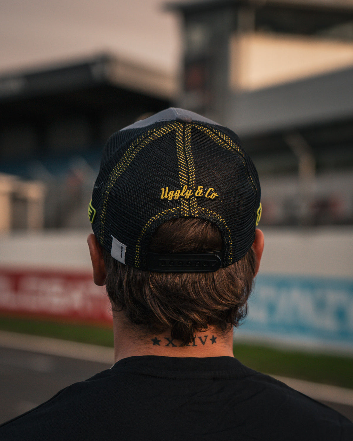 detail photo showing mesh and rear closing on black and white trucker hat
