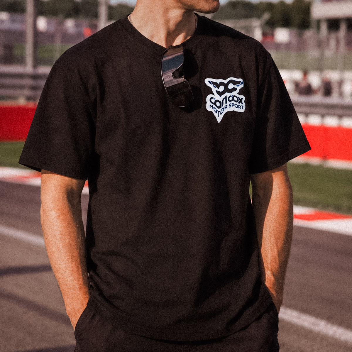 close up of t shirt graphic, carl cox motorsport t shirt worn by Simon reid