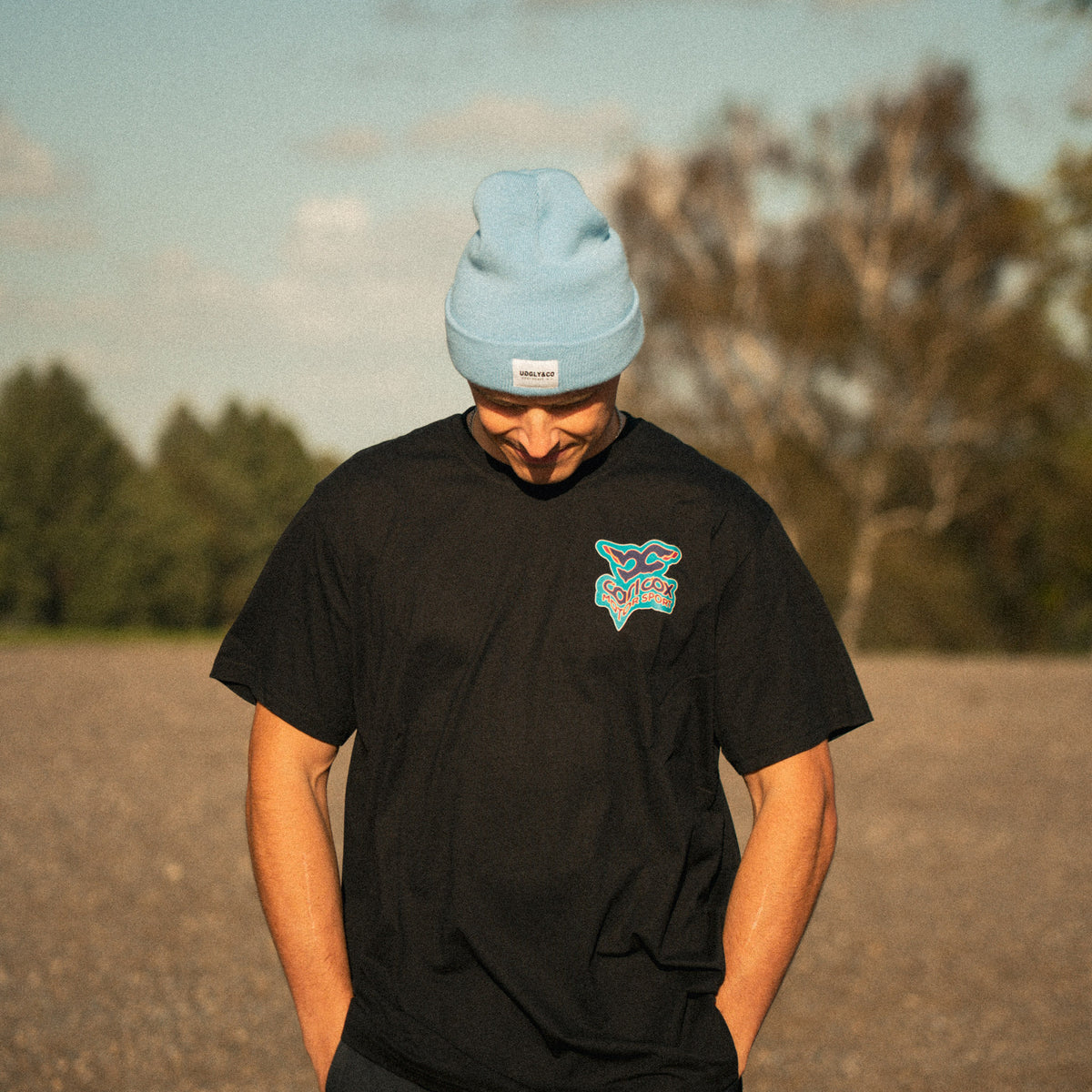 bsb rider Simon Reid wearing carl cox motorsport t shirt and blue beanie in lifestyle setting
