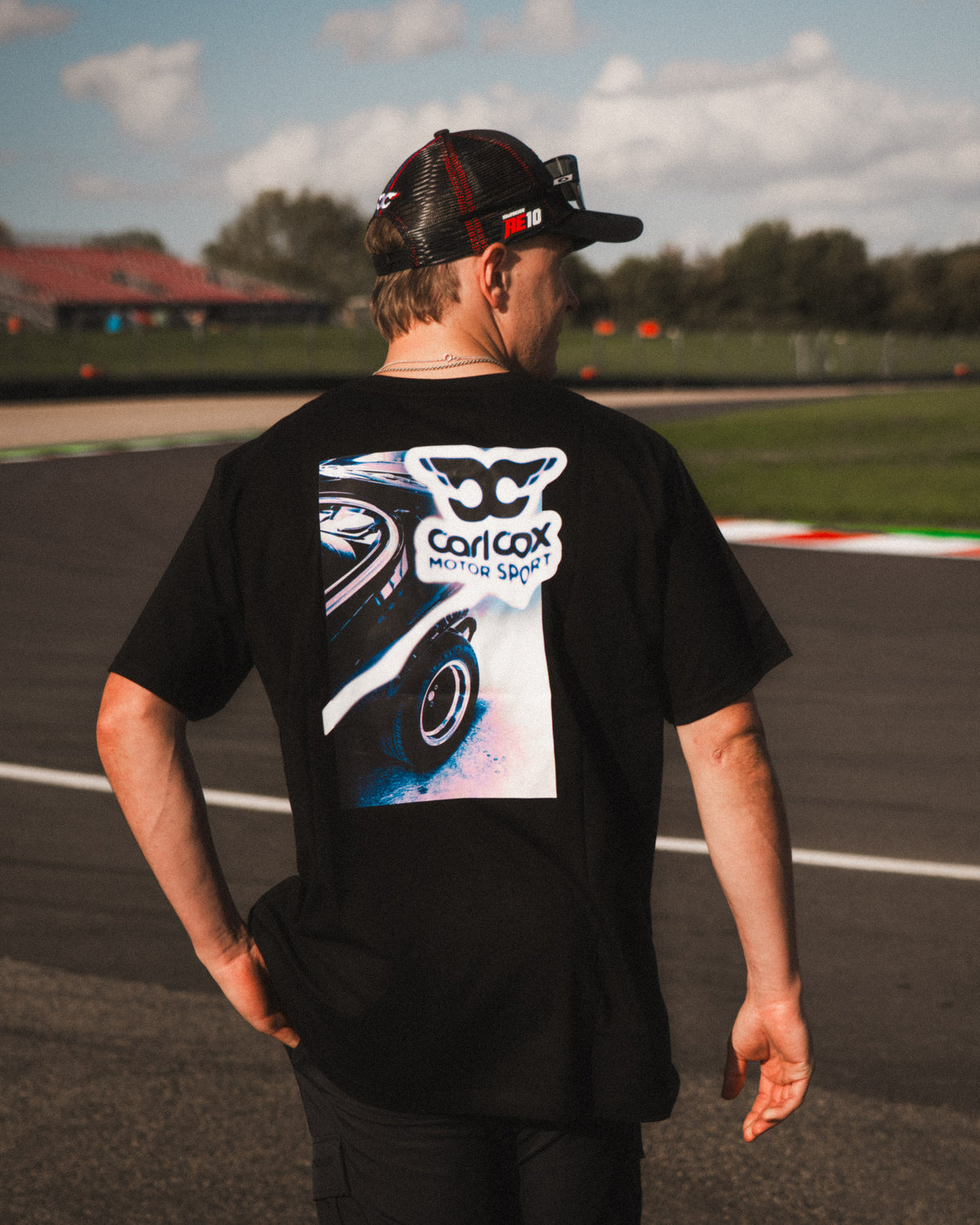 Rear view of the Carl Cox Trucker Hat by Uggly & Co, featuring breathable mesh panels and an adjustable snapback fastening.