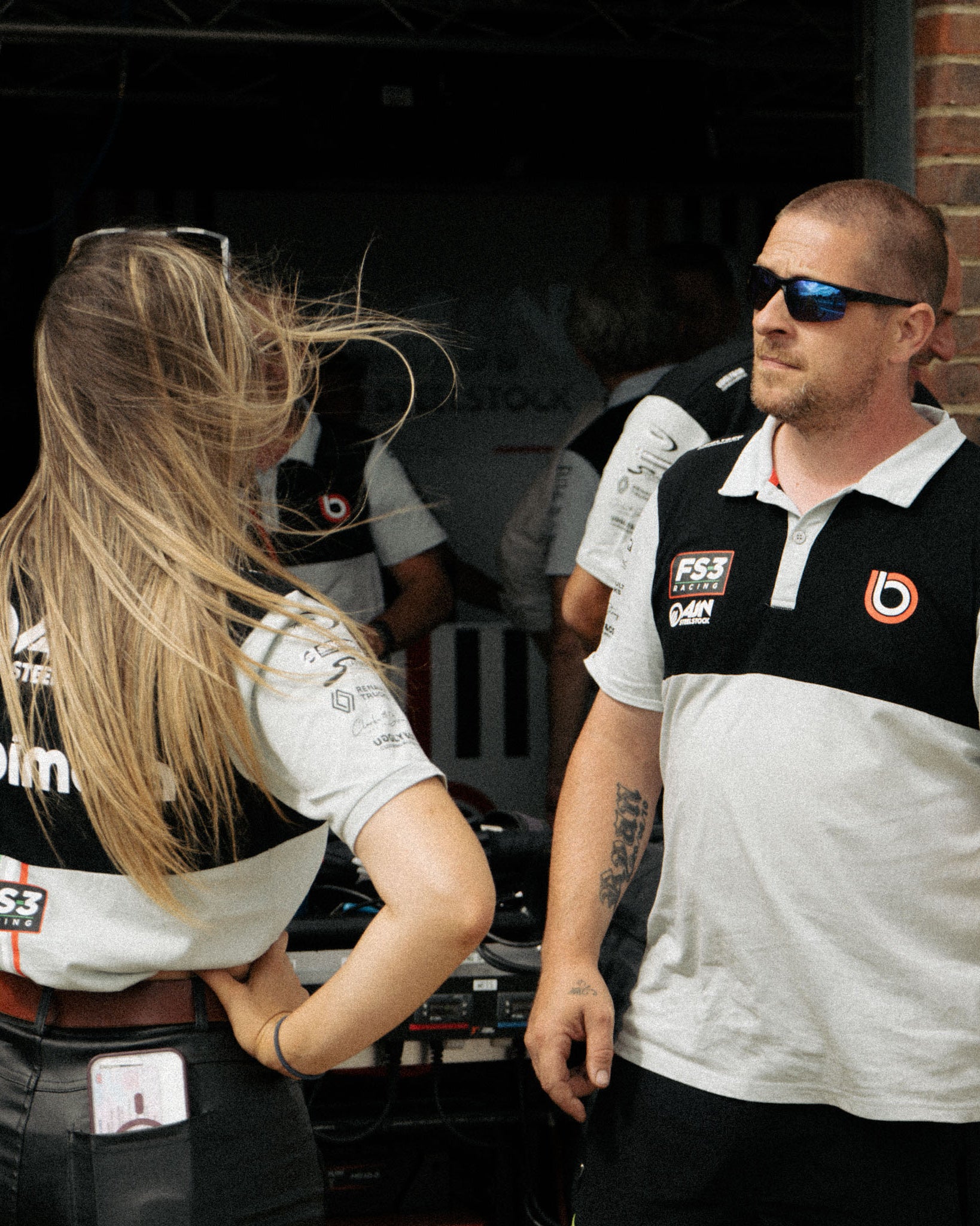 Trackside photo of the Bimota FS-3 BSB Polo Shirt worn by the team.