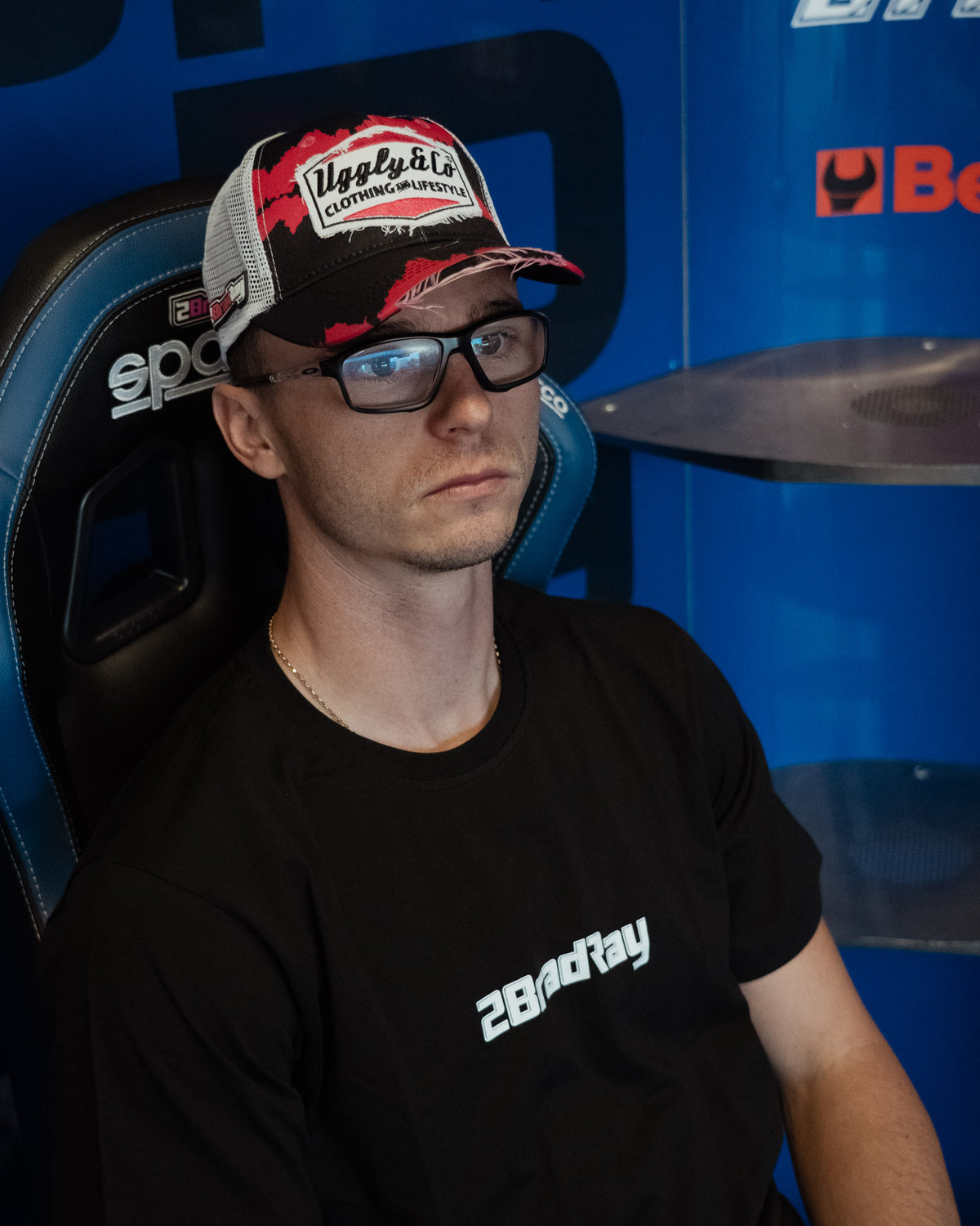Black Bradley Ray 'Take the Risk' T-Shirt in a McAMS Yamaha motorcycle garage setting