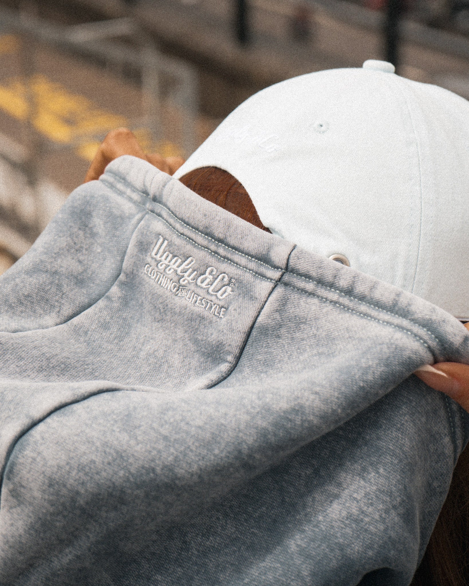 Close-up of the hood and blue acid wash finish on the women’s hoodie.