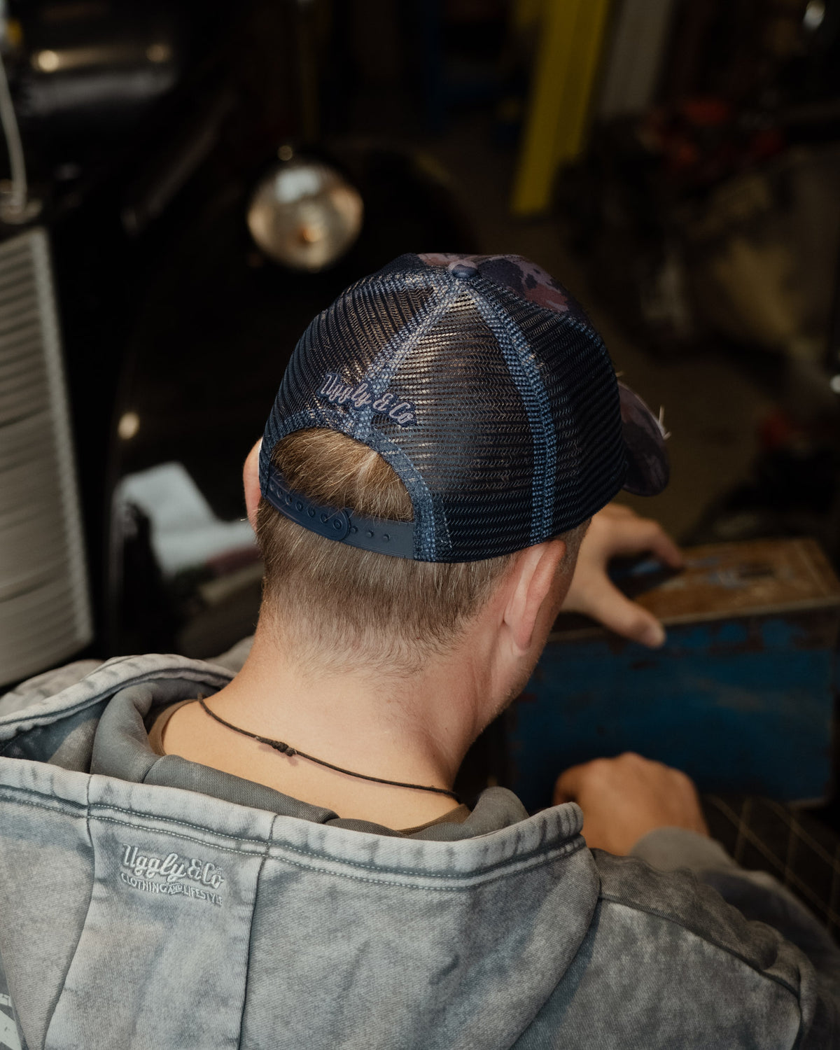 Back view of the Blue Camo Diamond Trucker Hat with mesh panels