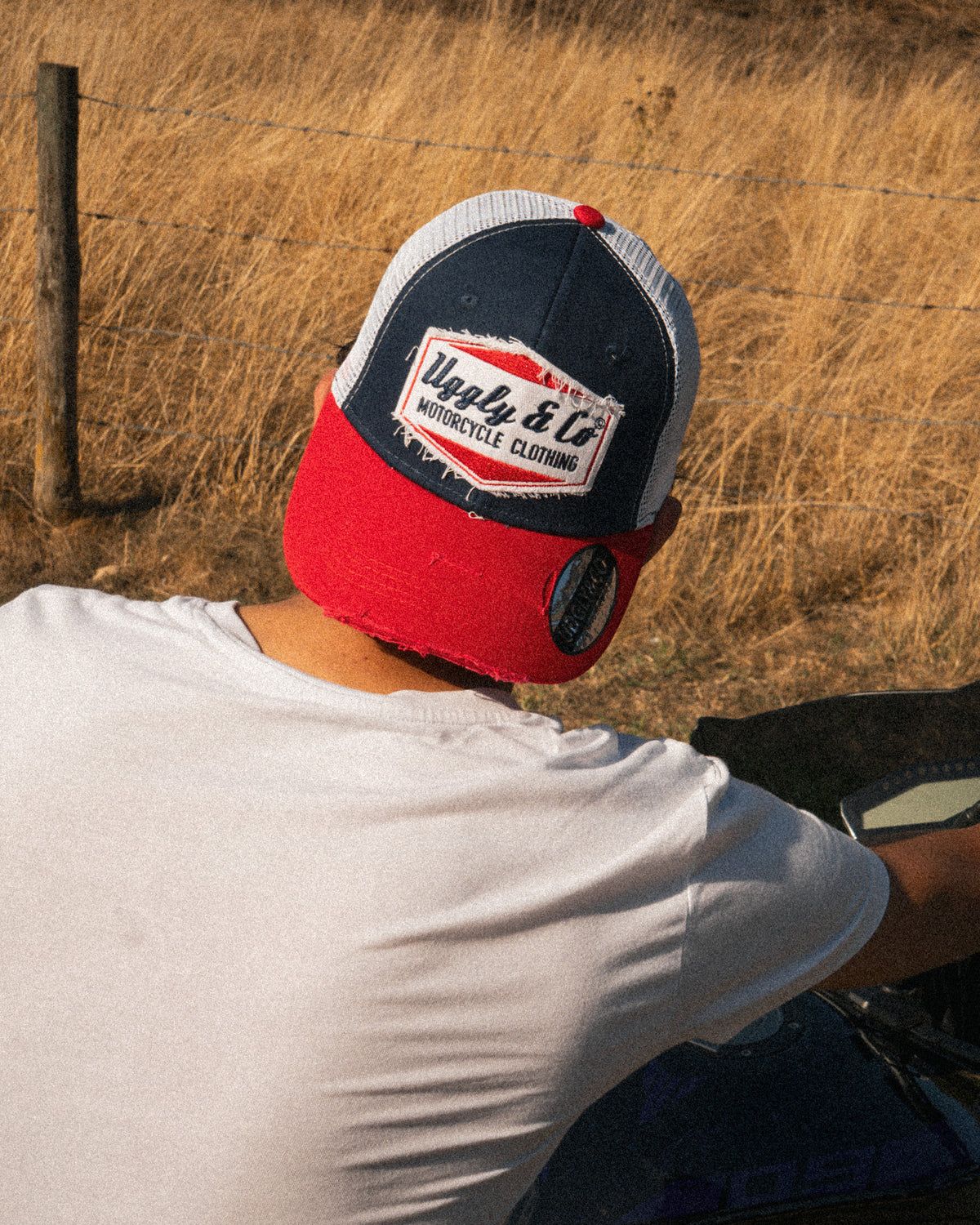 Back view of the Blue and Red Diamond Trucker Hat showing the mesh panels and adjustable closure