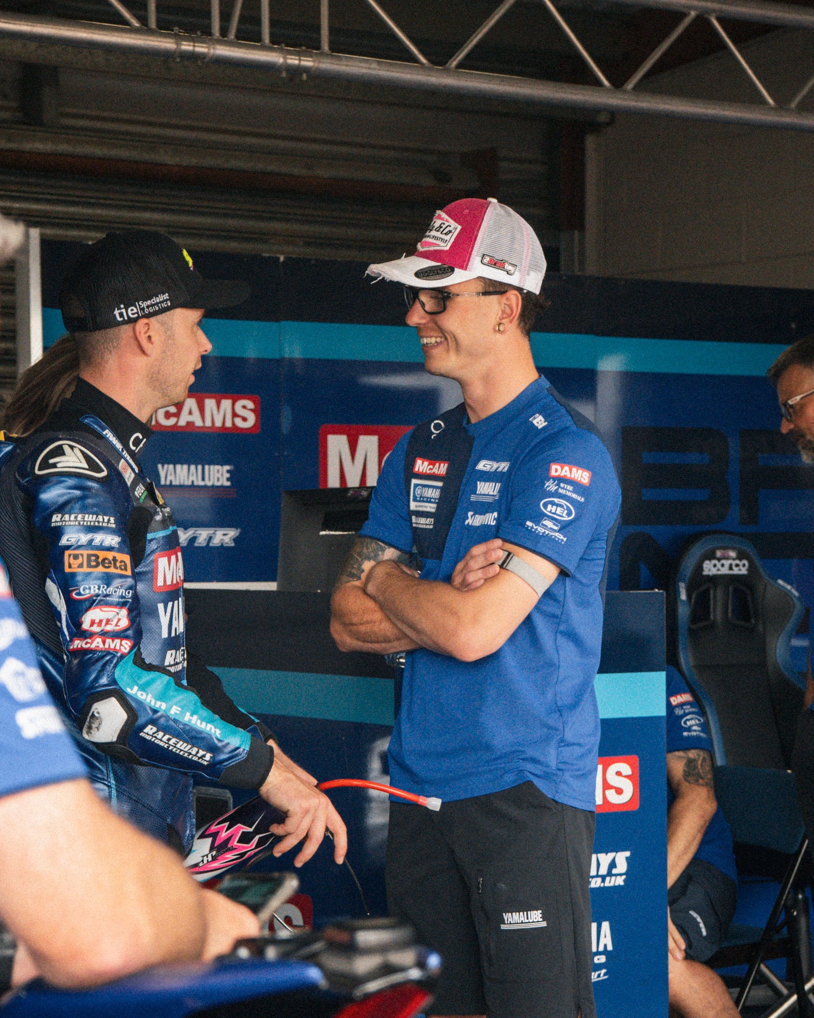 brad ray with mechanics in the pit lane of bsb race