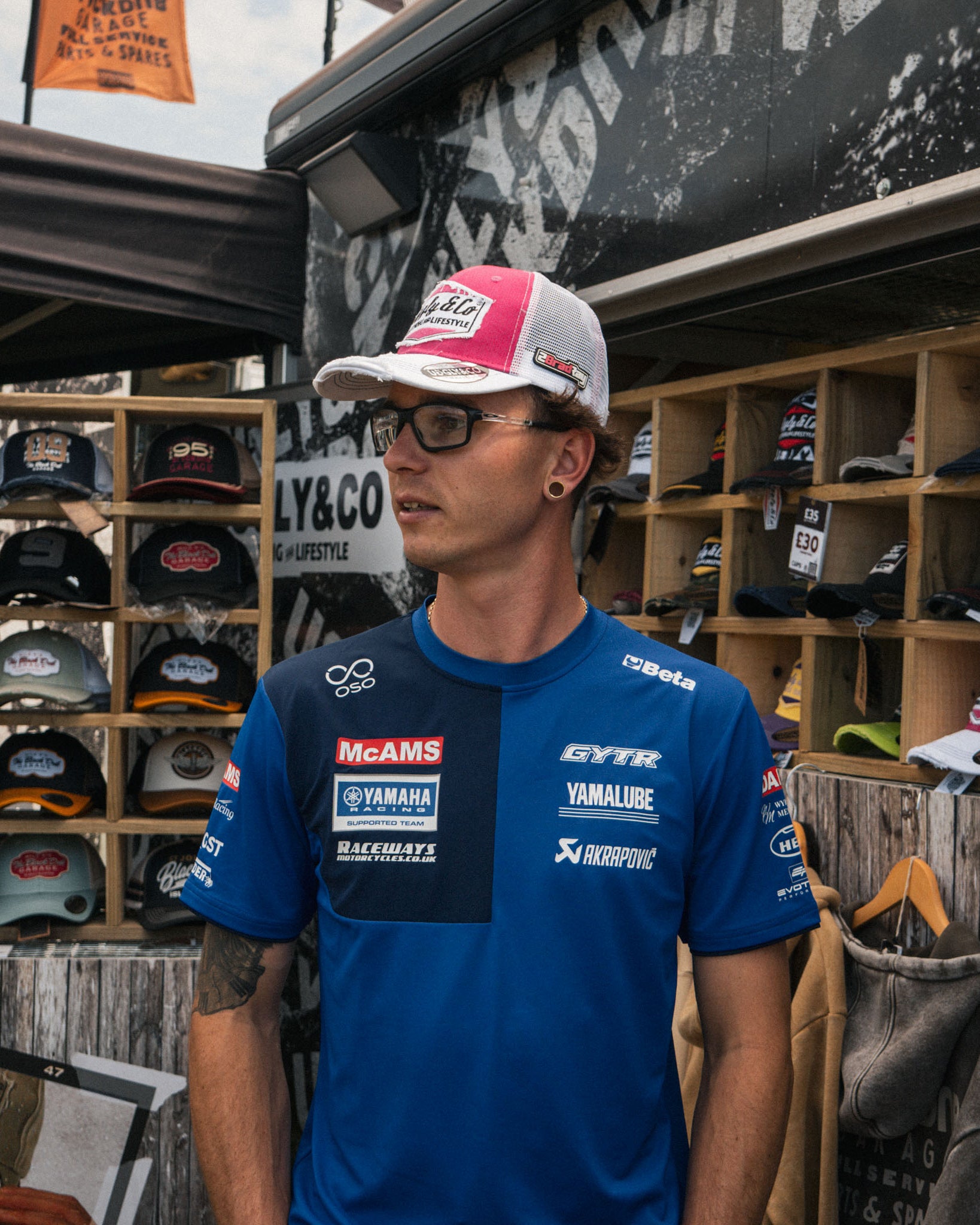 brad ray at motorbike event in trucker hat