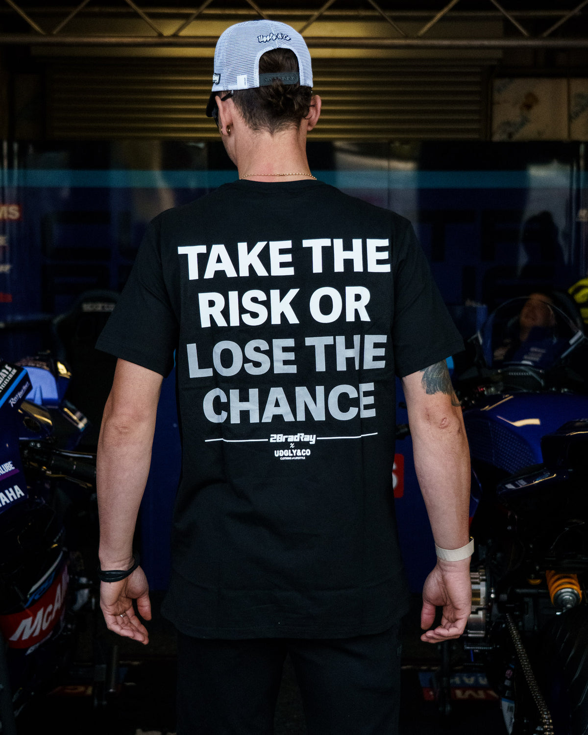 Black Bradley Ray T-Shirt photographed in a Yamaha British Superbikes garage