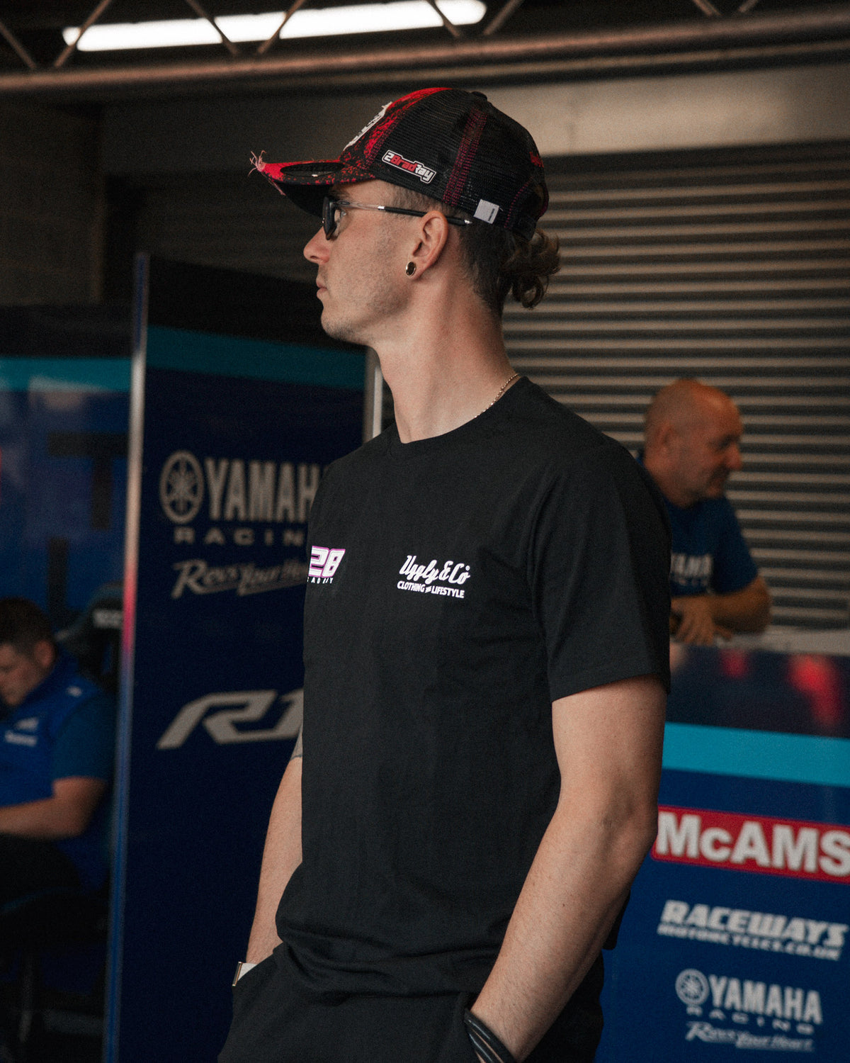 Bradley Ray #28 Black T-Shirt in a Yamaha racing garage setting