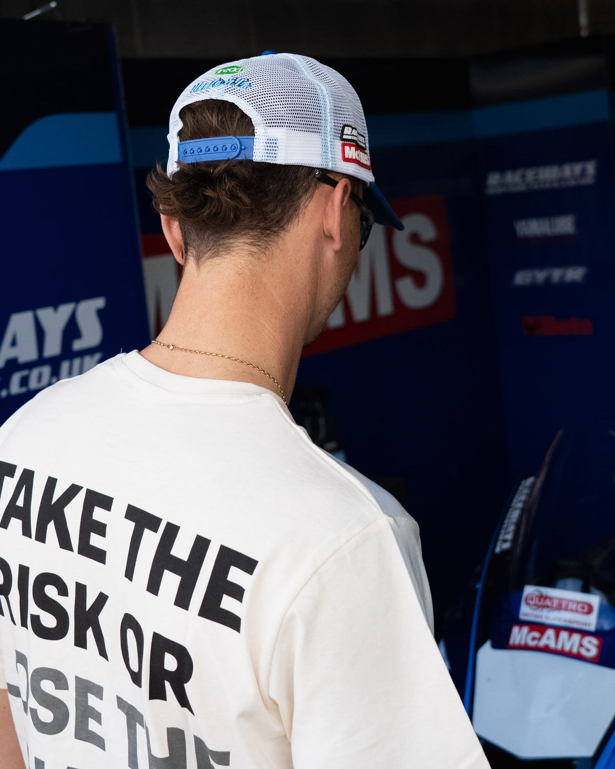 White Bradley Ray T-Shirt photographed in a Yamaha British Superbikes garage