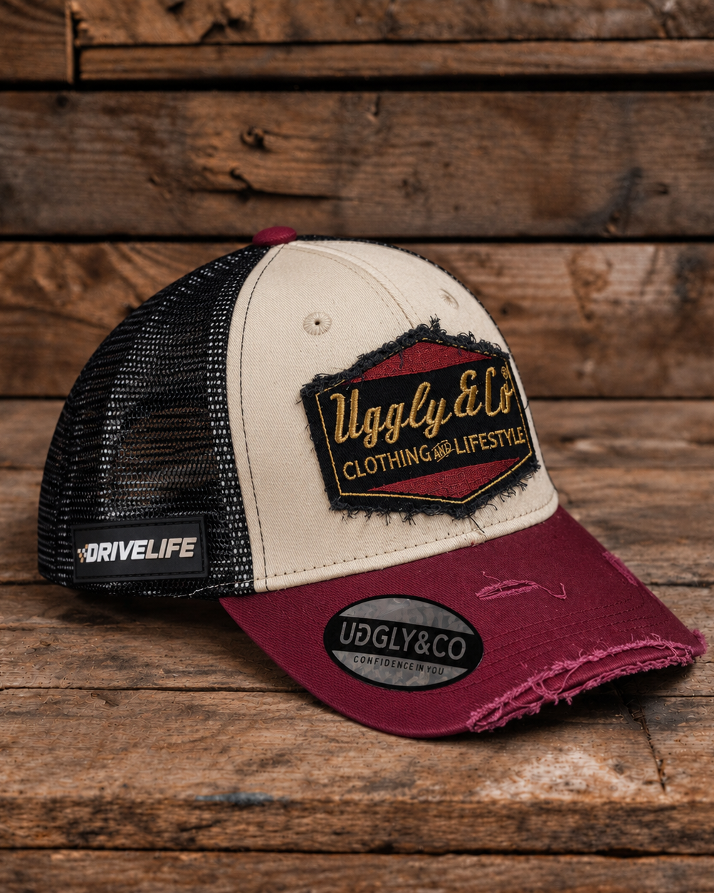 Burgundy, beige and gold Diamond trucker cap by Uggly & Co, front view with drive life badge