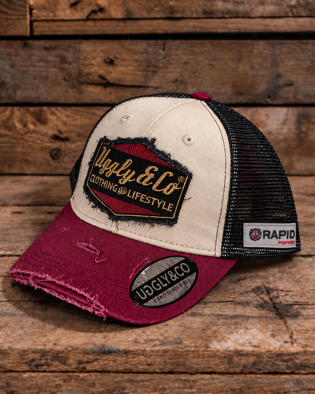 Burgundy, beige and gold Diamond trucker cap by Uggly & Co, front view with rapid Honda badge