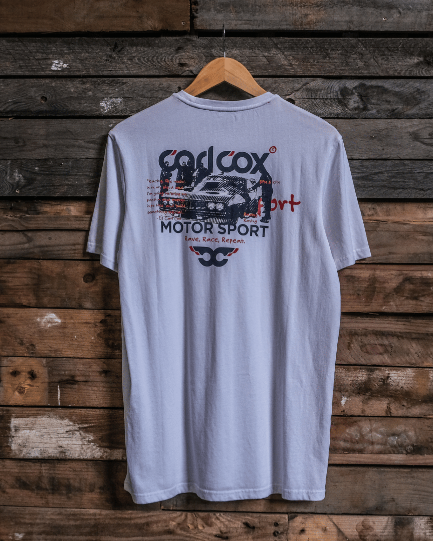Rear view of a Carl Cox Motorsport drag racing santa pod graphic white t-shirt on a wooden background