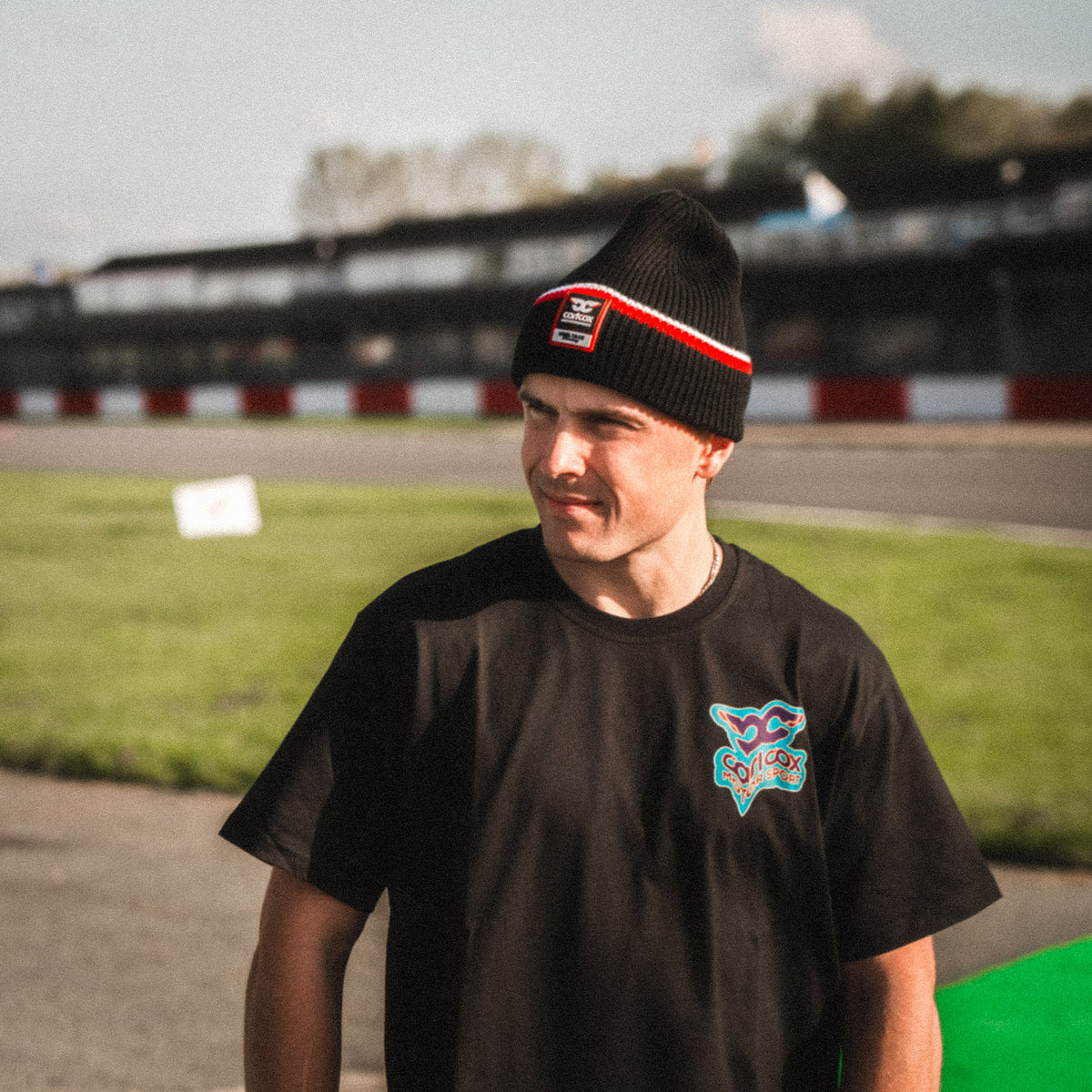 Carl Cox North West 200 Beanie photographed trackside at the North West 200 motorcycle road races in Northern Ireland, showcasing Uggly & Co motorsport merchandise.