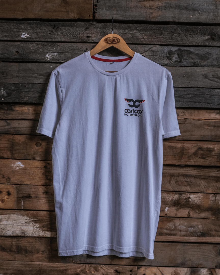 Front view of a Carl Cox Motorsport drag racing santa pod graphic white t-shirt on a wooden background
