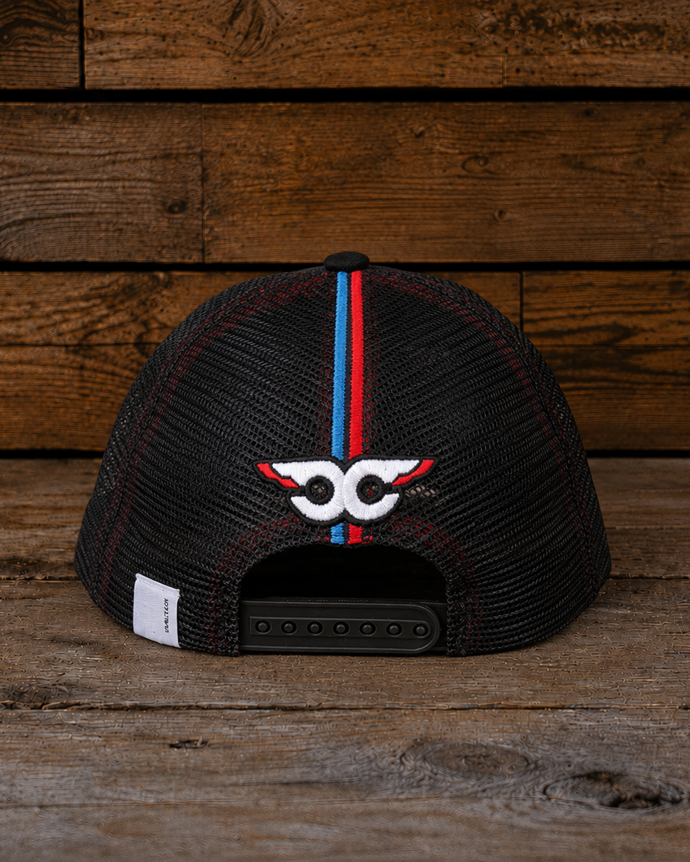 Back view of the Carl Cox Trucker Hat x Simon Reid featuring black mesh, snapback closure and embroidered rear detailing.