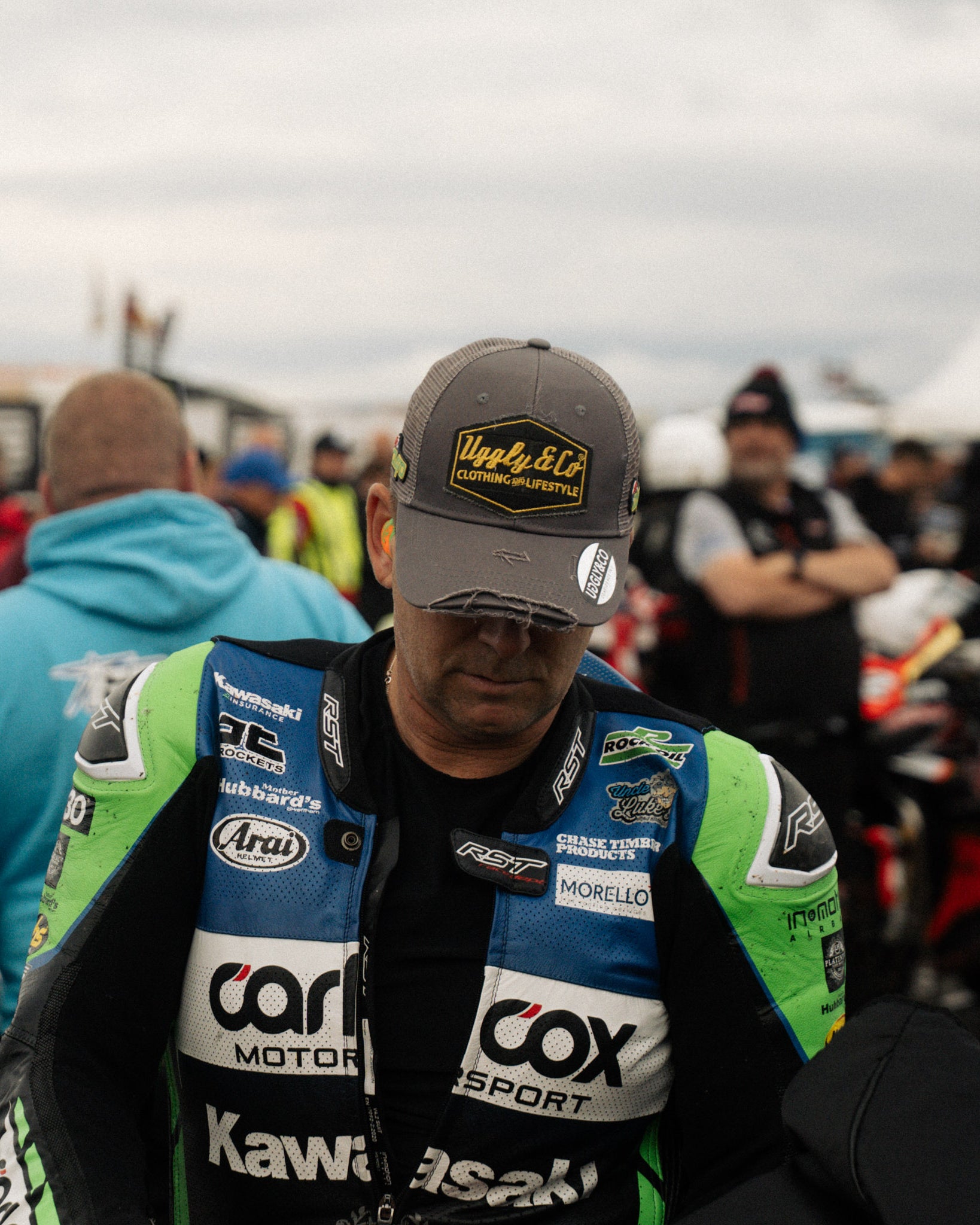 Davo Johnston in trucker hat on race grid at motorbike event