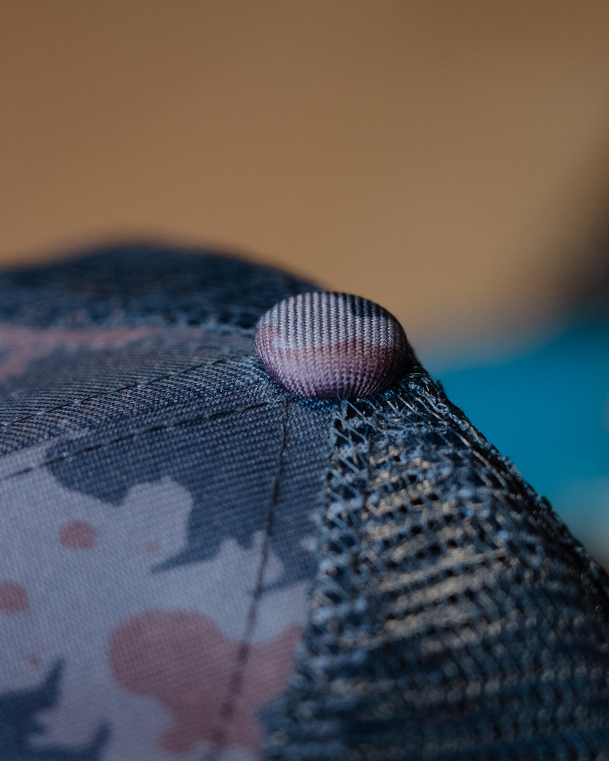 top detail shot of blue camo trucker hat