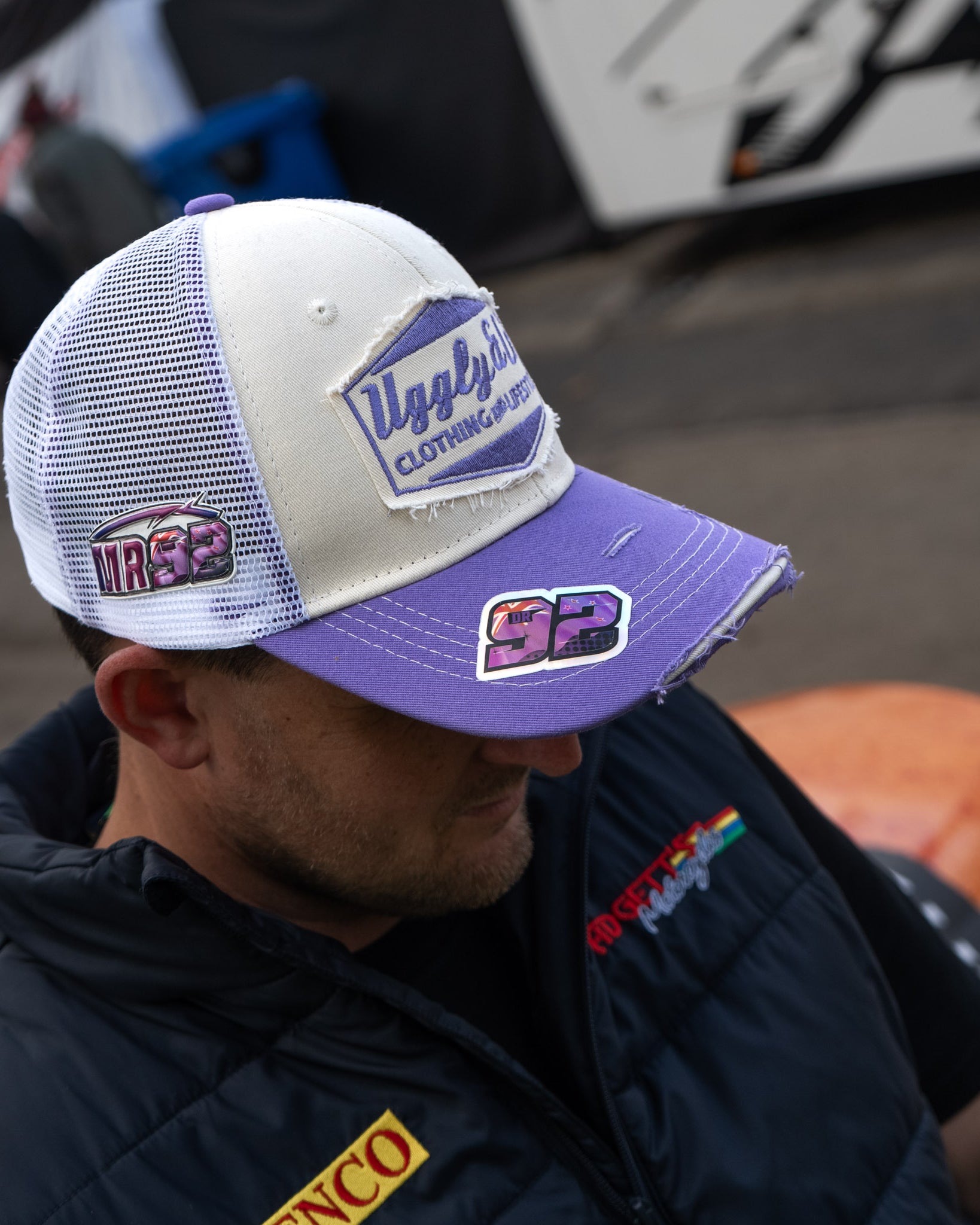 Mitch Rees wearing the Uggly&Co Diamond Trucker Hat at a motorcycle racing event