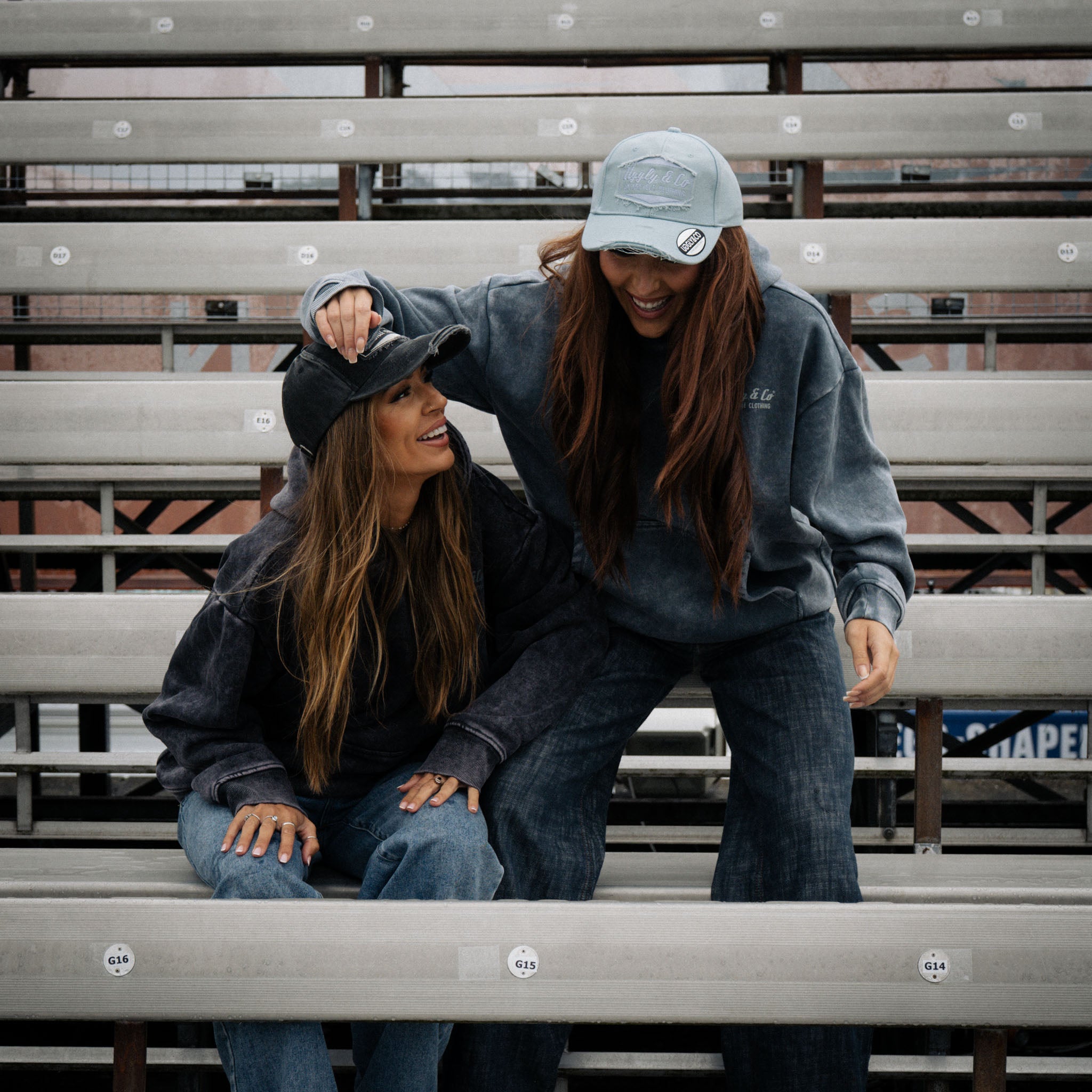 female models wearing vintage clothing in race grandstand