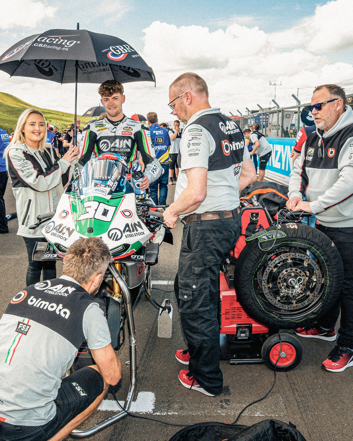 Max Cook on bsb grid, FS3 Racing Bimota motorsport hoodie with race team inspired graphics and grey hood