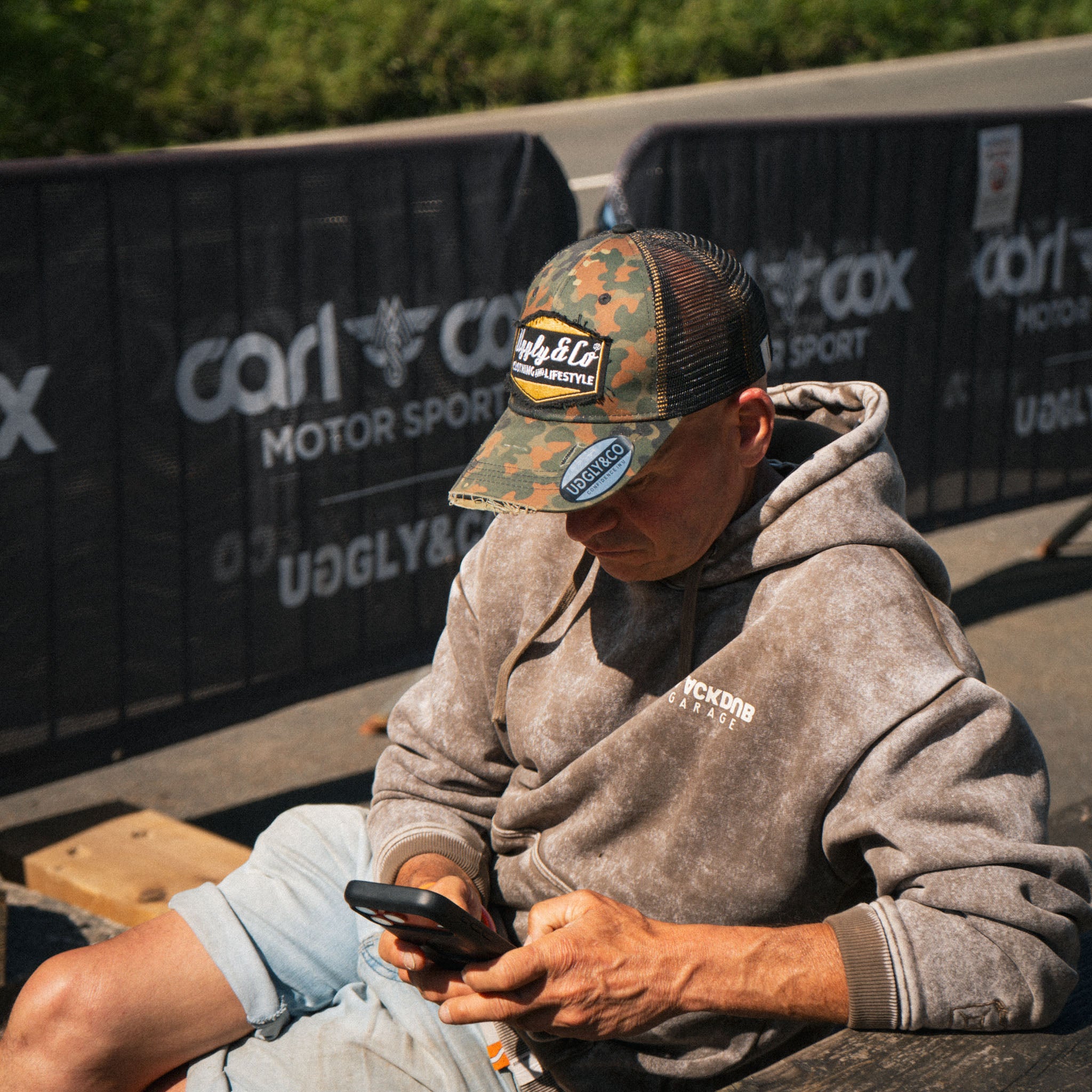 man at race event wearing camo hat