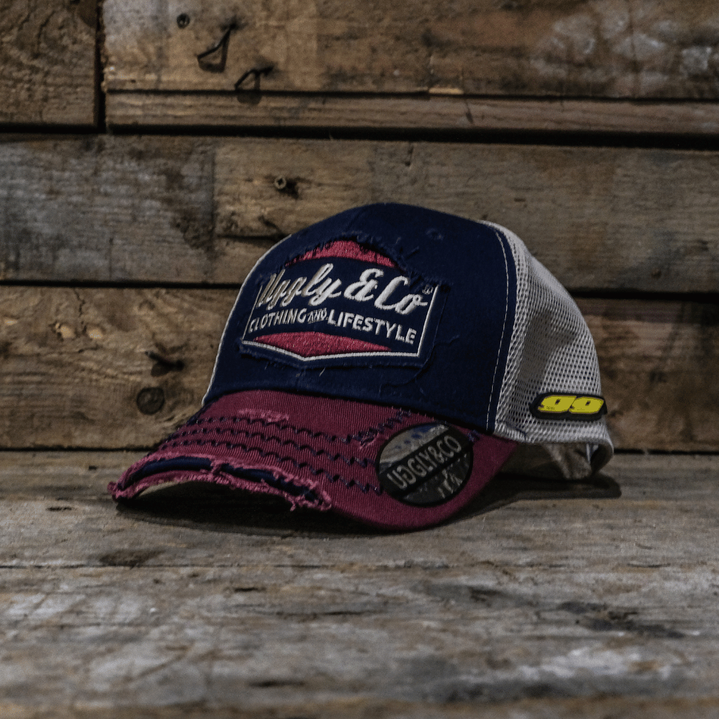 Baseball cap with brand logo on a wooden background, Jeremy McWilliams 9 on the side of cap.