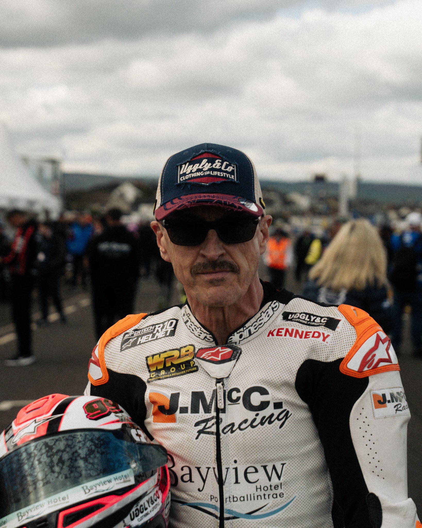 Jeremy McWilliams wearing Diamond trucker hat at motorcycle racing event portrait