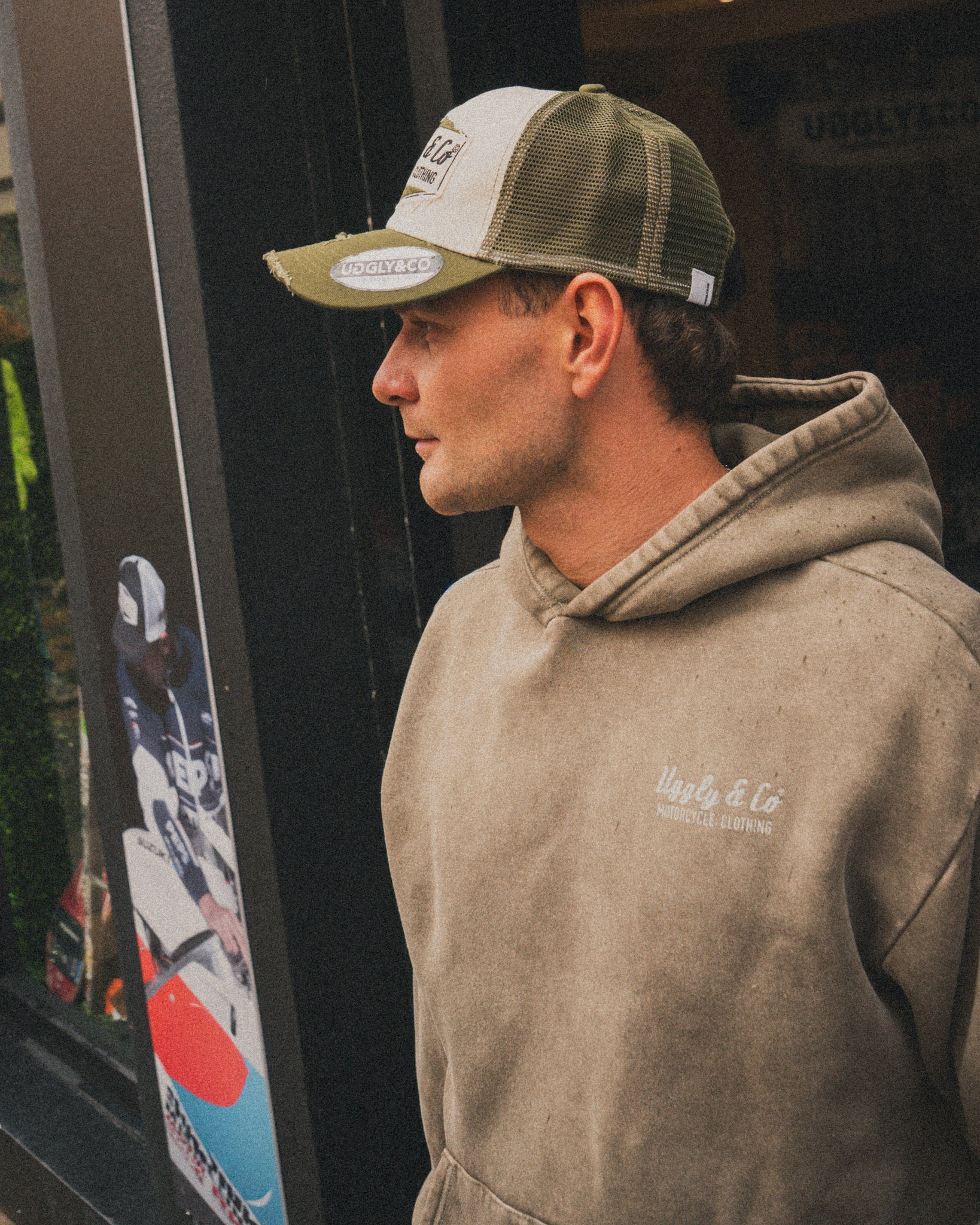 Joey Thompson wearing the green Diamond acid wash hoodie in a casual lifestyle setting.
