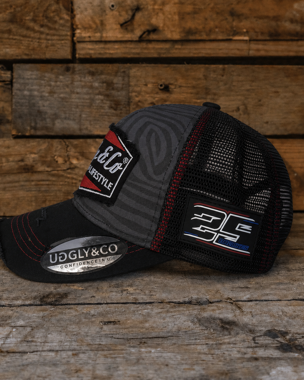 Side angle of the Josh Brooks x Diamond Zebra Cap showing the mesh back, curved peak and motorsport-inspired design.