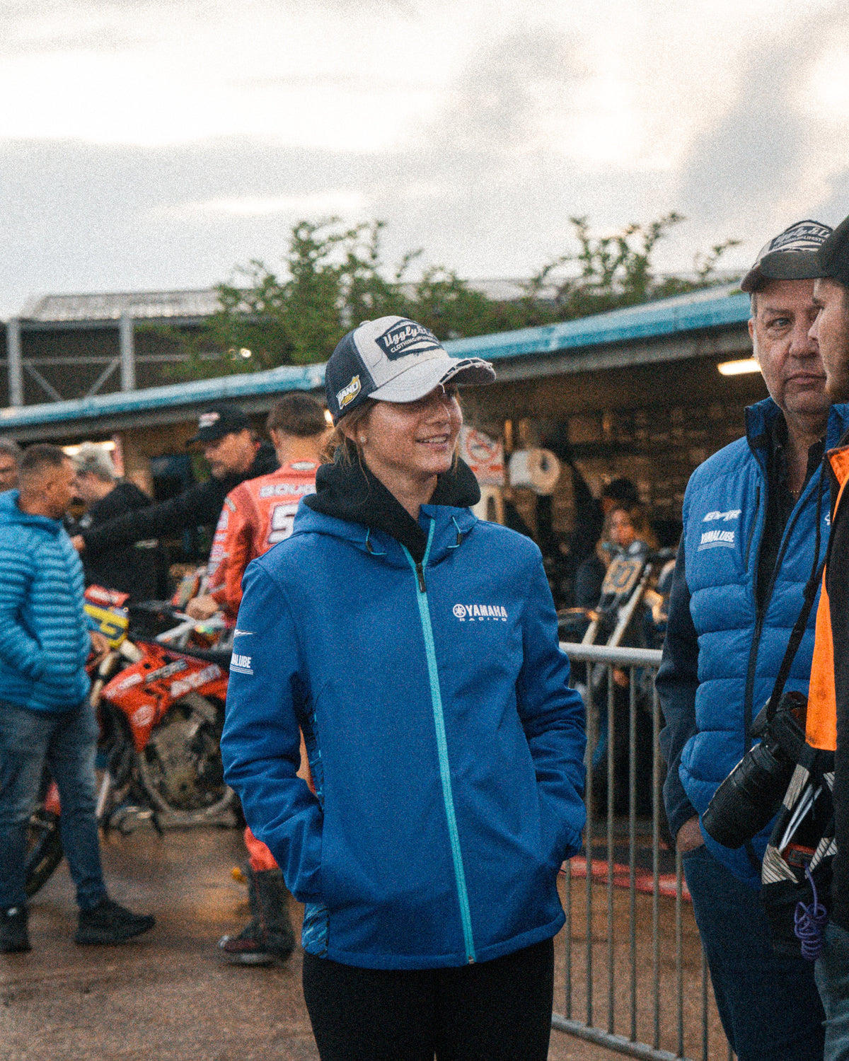 Katie Hand wearing the Off White and Navy Diamond Cap in the race paddock