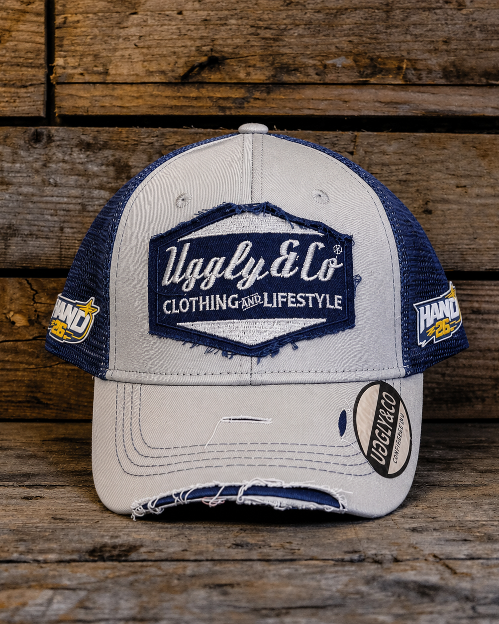front view product photo of the Katie Hand signature Off White and Navy Diamond Trucker Hat