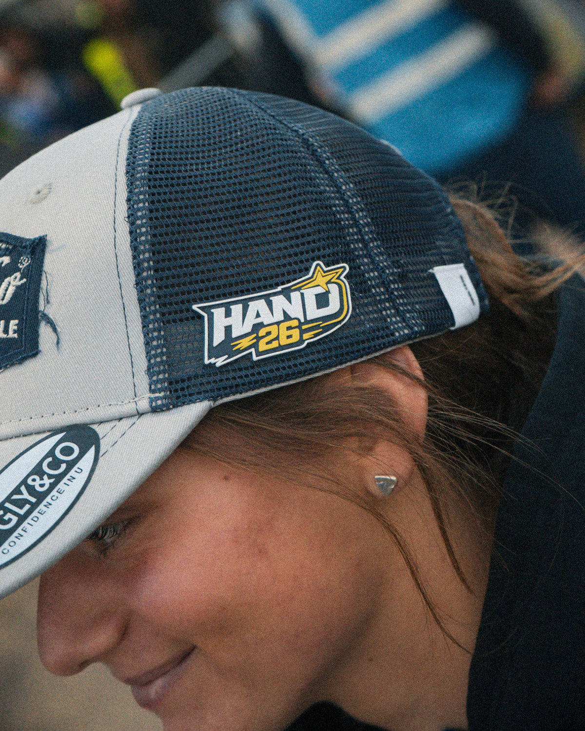 Motorcycle rider Katie Hand wearing her signature Uggly&Co Diamond Trucker Hat