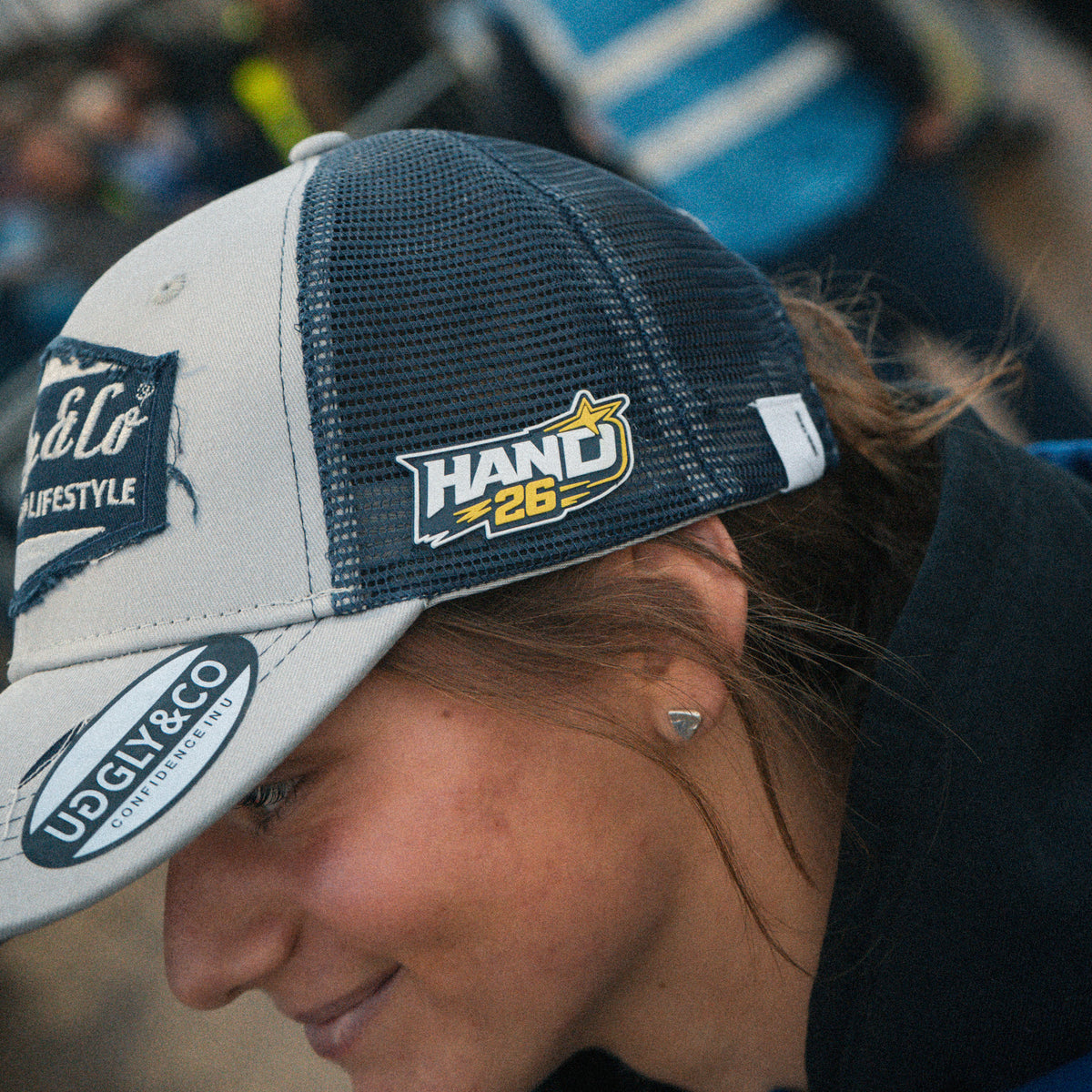 Motorcycle rider Katie Hand wearing her signature Uggly&Co Diamond Trucker Hat