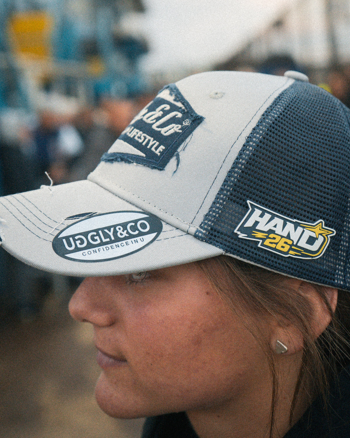 Close-up of Katie Hand wearing the Uggly&Co Off White and Navy Diamond Cap