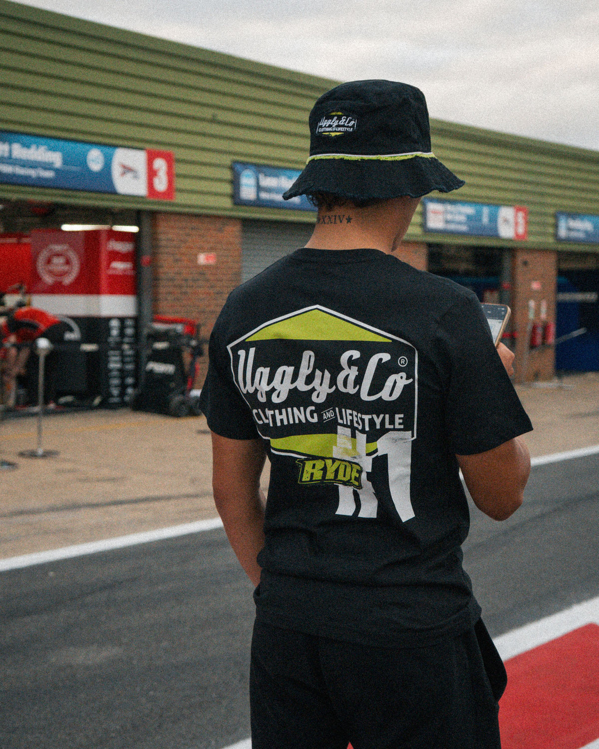 Pit lane photo of Kyle Ryde wearing the Uggly&Co Diamond T-Shirt before racing