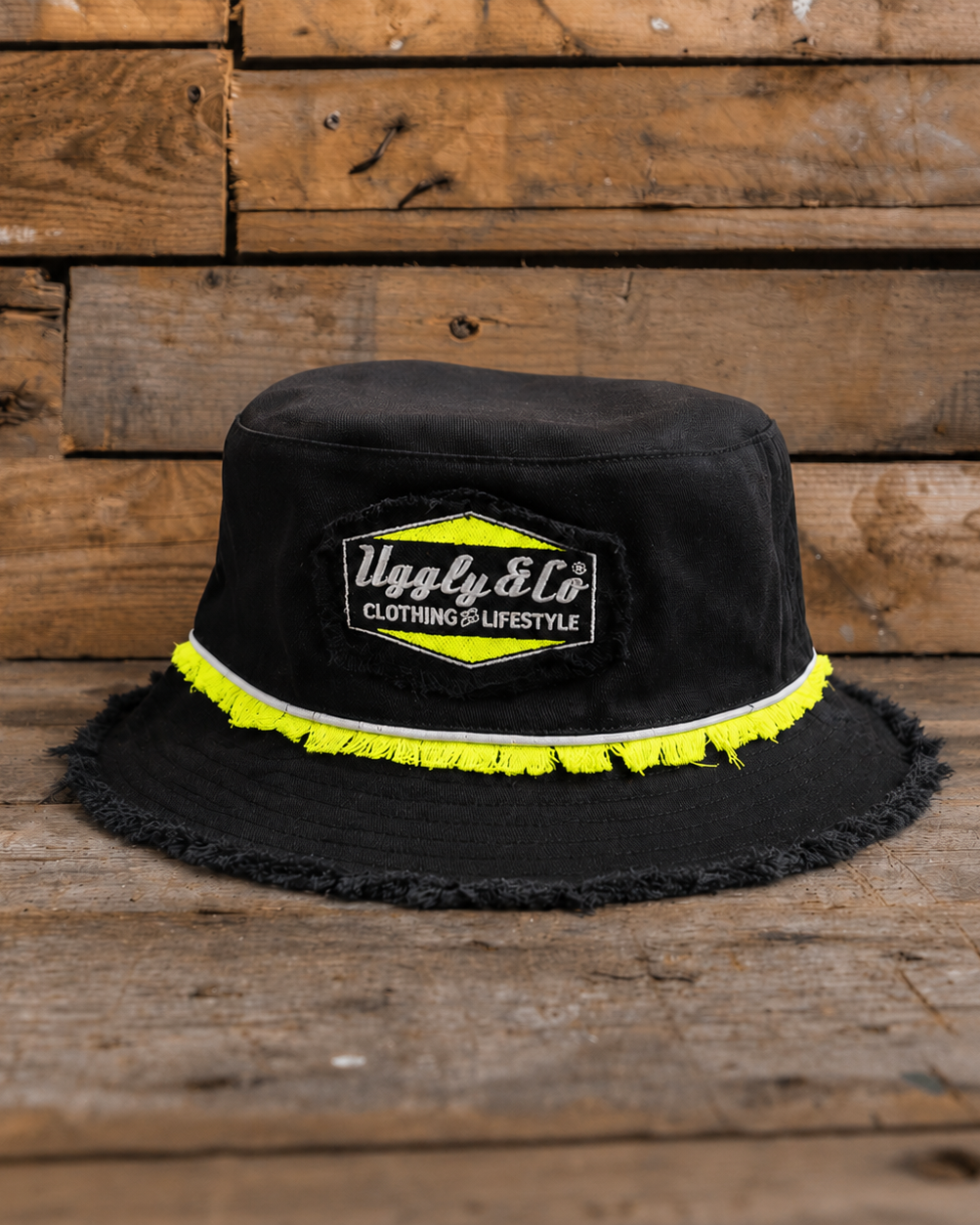 Kyle Ryde Diamond Bucket Hat product photo showing the Uggly&Co logo patch with neon yellow trim.