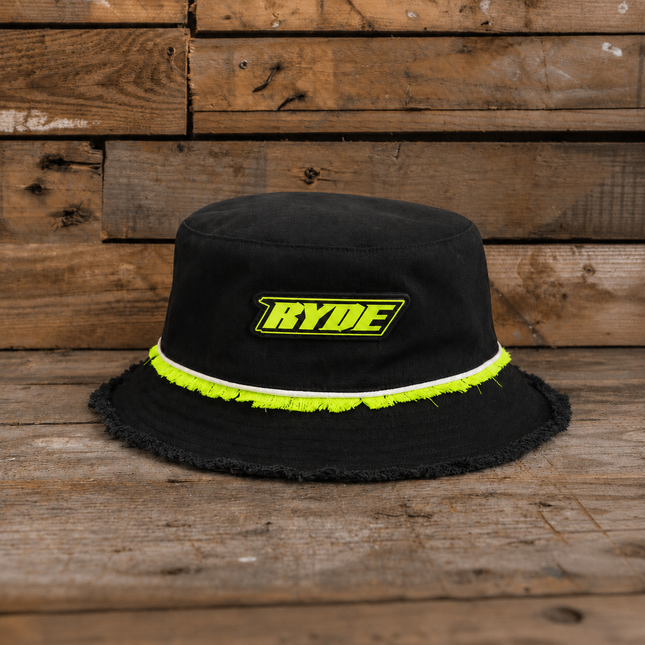 Kyle Ryde Diamond Bucket Hat front product photo featuring black fabric, neon yellow detailing and Ryde logo patch.
