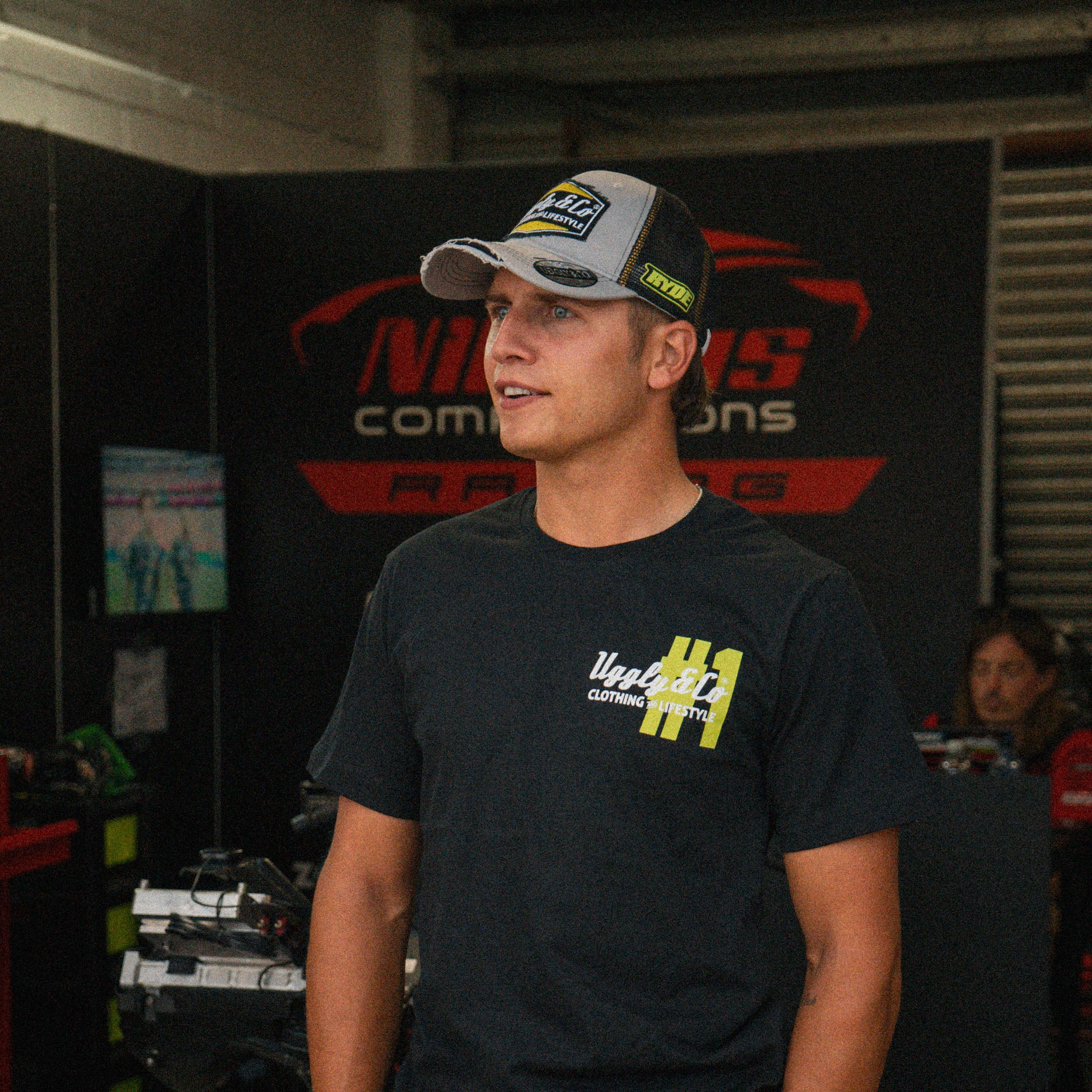 Kyle Ryde wearing the Uggly&Co Diamond T-shirt at a race event