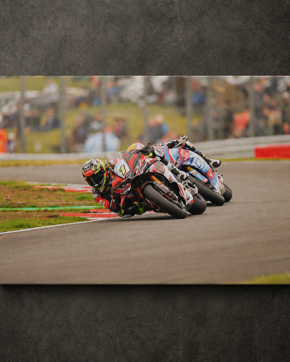 Kyle Ryde leading through a corner during a British Superbike race with another rider close behind, shown as canvas wall art.