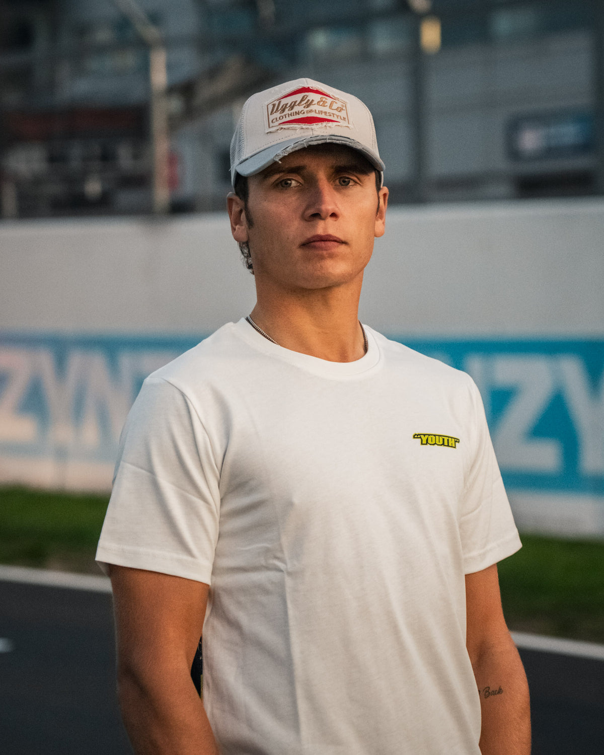Kyle Ryde White Graphic T-Shirt photographed trackside at Donington Park, showcasing Uggly & Co motorcycle lifestyle clothing.