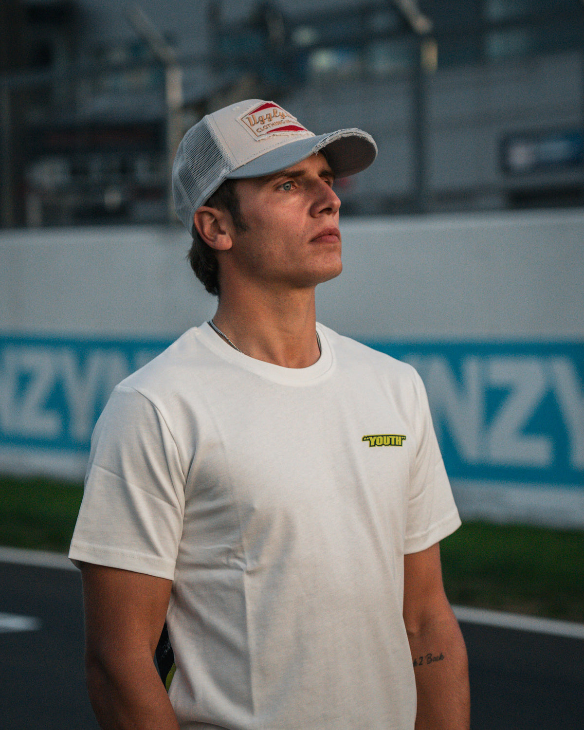 Model wearing the Kyle Ryde White Graphic T-Shirt by Uggly & Co, combining British Superbike racing heritage with casual motorcycle streetwear.