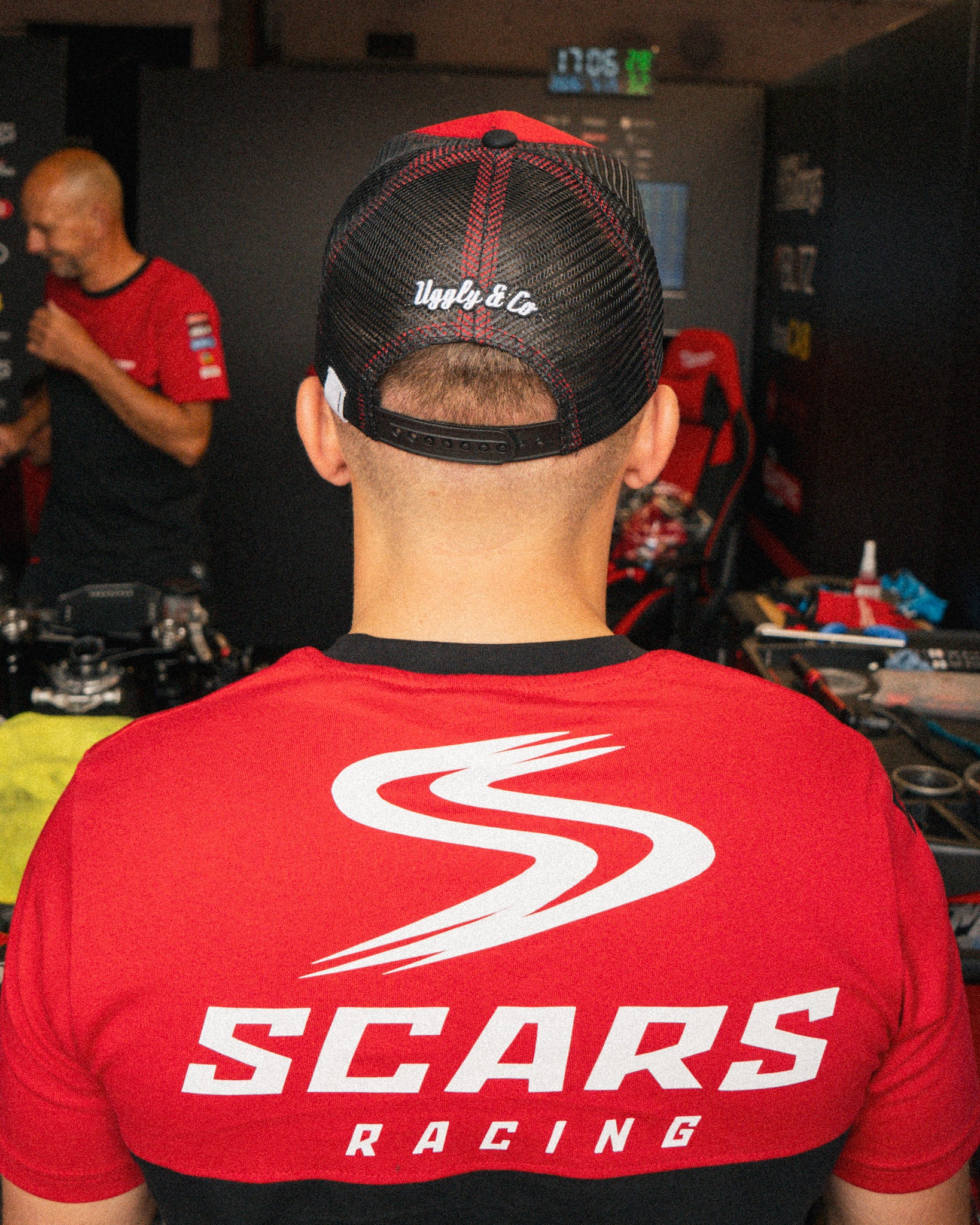 Luke Stapleford wearing a black Scars Racing T-shirt in the pit lane