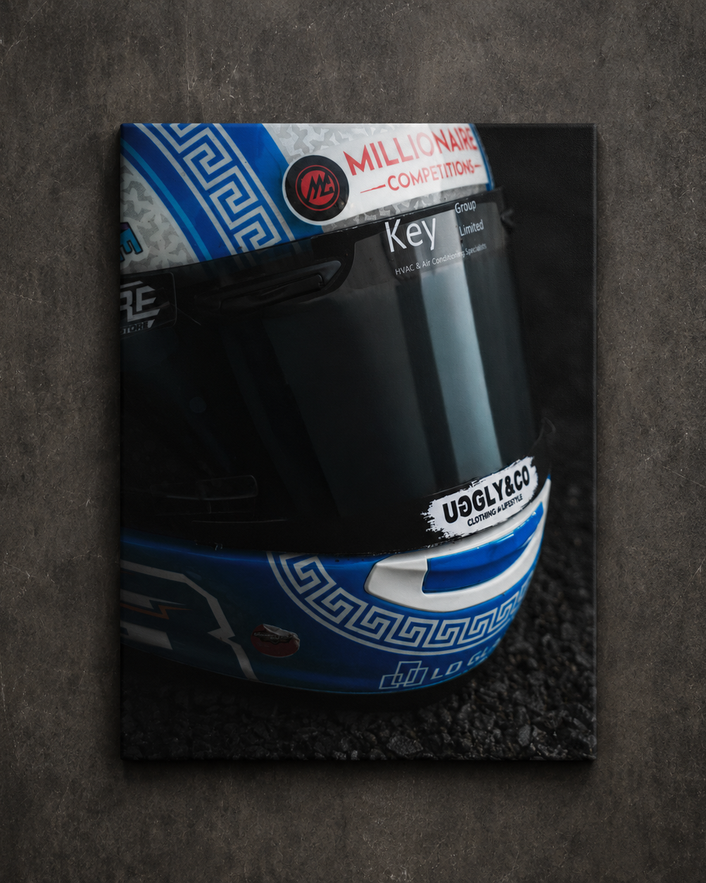 Close up of Marcus Simpson’s blue and white Uggly & Co racing helmet with dark visor, shown as canvas wall art.
