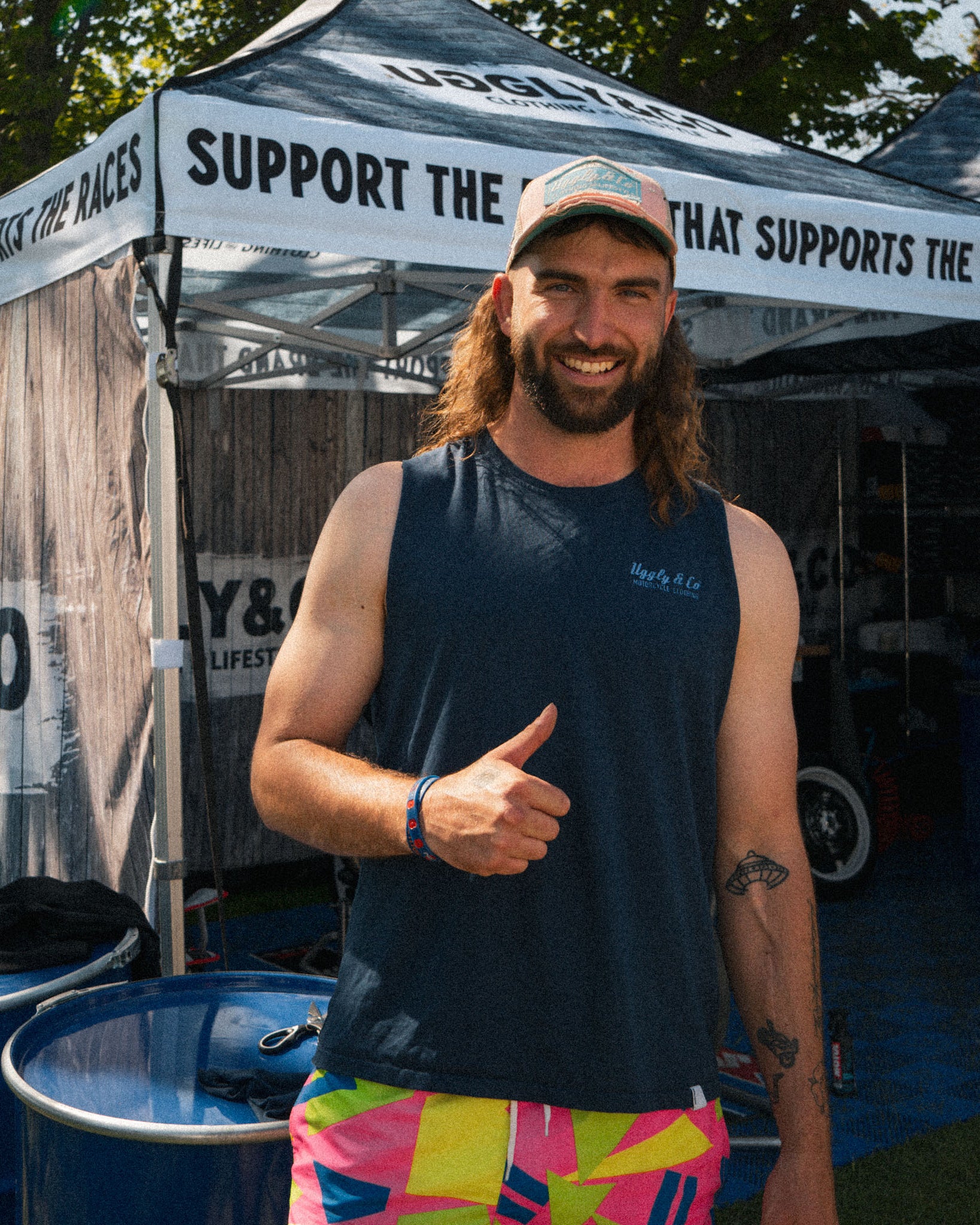 Matt Stevenson wearing a pastel pink and blue cap